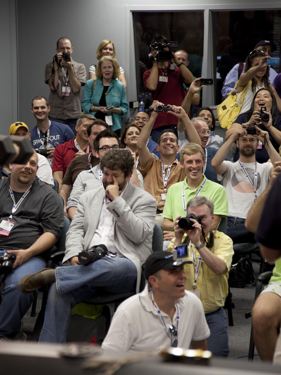 CAPE CANAVERAL, Fla. -- At NASA's Kennedy Space Center in Florida, participants of the STS-133 Tweetup snap photos and watch intently as a dexterous humanoid astronaut helper, known as Robonaut, shows off its talents. Robonaut 2 (R2) will be delivered to the International Space Station on space shuttle Discovery's STS-133 mission. Although R2 will initially only participate in operational tests, upgrades could eventually allow the robot to realize its true purpose -- helping spacewalking astronauts with tasks outside the orbiting laboratory. NASA is hosting about 150 of its Twitter followers from around the world and several dozen states and providing them with a behind-the-scenes perspective to share with their own followers on the social networking service. The "Tweeps," as NASA calls them, will have a chance to tour Kennedy, meet with shuttle technicians, managers, engineers and astronauts, and witness Discovery's launch. Discovery and its STS-133 crew are scheduled to lift off Nov. 3 at 3:52 p.m. EDT. For more information on the upcoming mission, visit www.nasa.gov/mission_pages/shuttle/shuttlemissions/sts133/. Photo credit: NASA/Frank Michaux