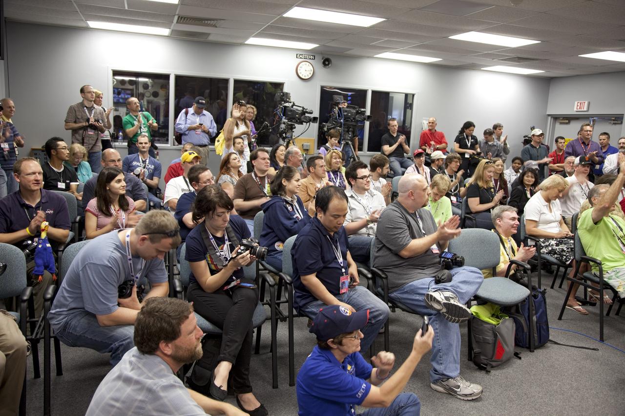 CAPE CANAVERAL, Fla. -- At NASA's Kennedy Space Center in Florida, participants of the STS-133 Tweetup snap photos and watch intently as a dexterous humanoid astronaut helper, known as Robonaut, shows off its talents. Robonaut 2 (R2) will be delivered to the International Space Station on space shuttle Discovery's STS-133 mission. Although R2 will initially only participate in operational tests, upgrades could eventually allow the robot to realize its true purpose -- helping spacewalking astronauts with tasks outside the orbiting laboratory. NASA is hosting about 150 of its Twitter followers from around the world and several dozen states and providing them with a behind-the-scenes perspective to share with their own followers on the social networking service. The "Tweeps," as NASA calls them, will have a chance to tour Kennedy, meet with shuttle technicians, managers, engineers and astronauts, and witness Discovery's launch. Discovery and its STS-133 crew are scheduled to lift off Nov. 3 at 3:52 p.m. EDT. For more information on the upcoming mission, visit www.nasa.gov/mission_pages/shuttle/shuttlemissions/sts133/. Photo credit: NASA/Frank Michaux