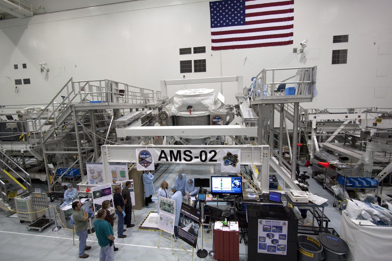 CAPE CANAVERAL, Fla. -- In the Space Station Processing Facility at NASA's Kennedy Space Center in Florida, the Alpha Magnetic Spectrometer-2 (AMS) will be rotated 180 degrees to provide better access for work to be performed on its avionics box. Technicians also will install a flight releasable grappling fixture to AMS while it is upside down. AMS is designed to operate as an external experiment on the International Space Station. It will use the unique environment of space to study the universe and its origin by searching for dark matter. AMS will fly to the station aboard space shuttle Endeavour's STS-134 mission targeted to launch Feb. 27, 2011. Photo credit: NASA/Jack Pfaller