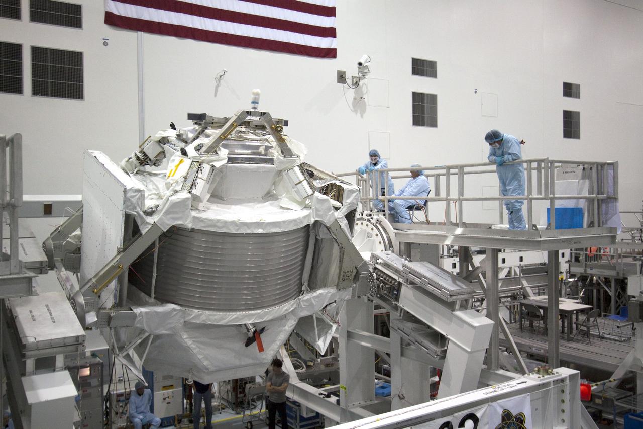 CAPE CANAVERAL, Fla. -- In the Space Station Processing Facility at NASA's Kennedy Space Center in Florida, the Alpha Magnetic Spectrometer-2 (AMS) rotates 180 degrees to provide better access for work to be performed on its avionics box. Technicians also will install a flight releasable grappling fixture to AMS while it is upside down. AMS is designed to operate as an external experiment on the International Space Station. It will use the unique environment of space to study the universe and its origin by searching for dark matter. AMS will fly to the station aboard space shuttle Endeavour's STS-134 mission targeted to launch Feb. 27, 2011. Photo credit: NASA/Jack Pfaller