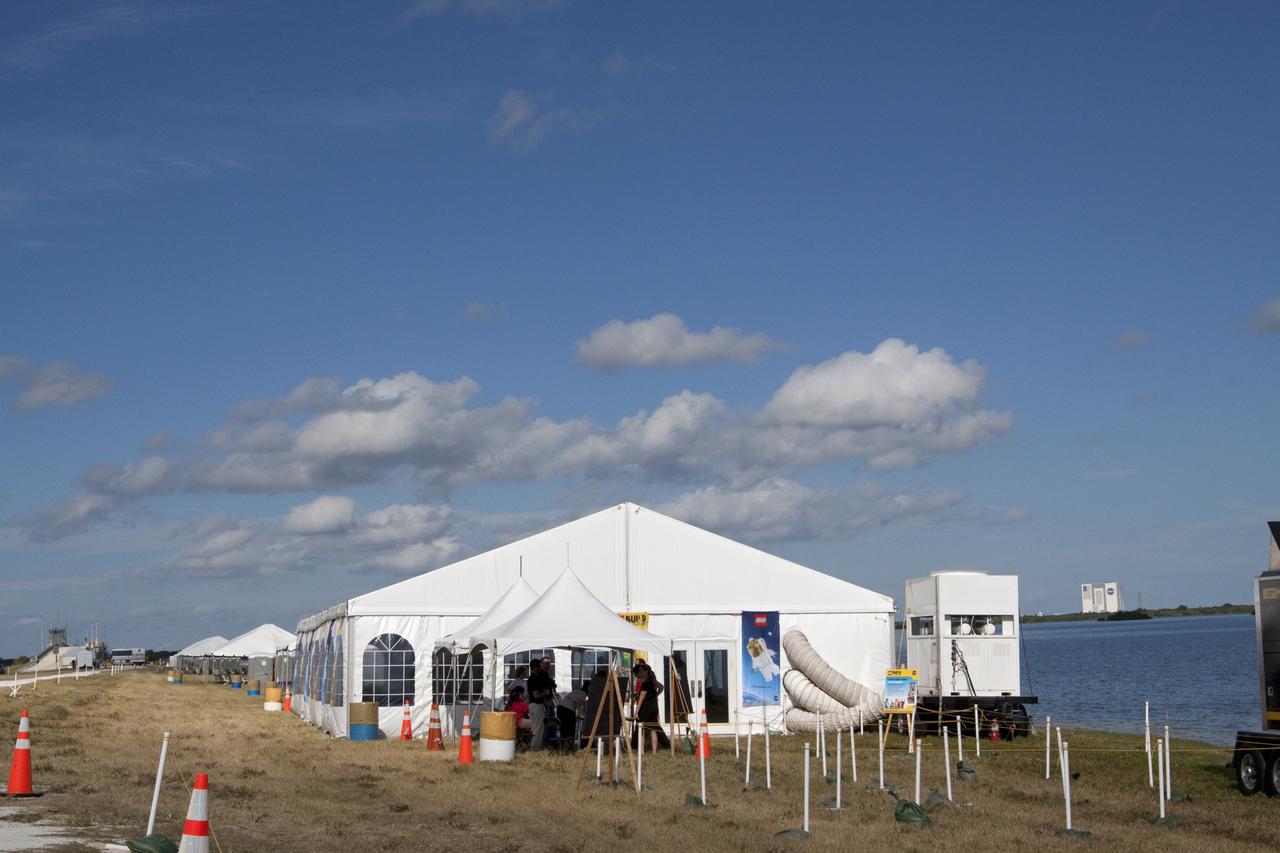 CAPE CANAVERAL, Fla. -- A 40- by 70-foot activity tent chock full of LEGO bricks is set up on the NASA Causeway at Kennedy Space Center in Florida. Inside, children of all ages will have the opportunity to build their vision of the future with LEGO bricks, marking the beginning of a three-year Space Act Agreement between NASA and The LEGO Group. The partnership is meant to spark the interest of children in science, technology, engineering and mathematics (STEM).             To commemorate the partnership, two small LEGO space shuttles will launch aboard space shuttle Discovery's STS-133 mission to the International Space Station and the company will release four NASA-inspired products in its LEGO CITY line next year. LEGO sets also will fly to the space station aboard Endeavour's STS-134 mission, and will be put together on orbit to demonstrate the challenges faced while building things in microgravity. Photo credit: NASA/Jack Pfaller