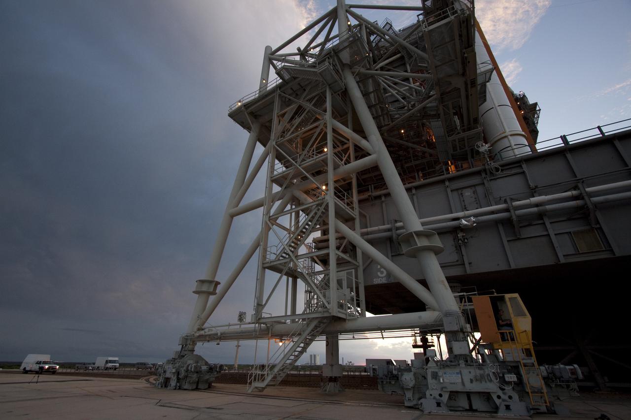 CAPE CANAVERAL, Fla. -- On Launch Pad 39A, technicians stop preparations to move the pad's rotating service structure away from space shuttle Discovery as storm clouds move in over NASA's Kennedy Space Center in Florida. The structure provides weather protection and access to the shuttle while it awaits lift off on the pad. RSS "rollback," as it's called, will begin again after the lightning-producing clouds pass. Launch of Discovery on the STS-133 mission to the International Space Station is set for 3:29 p.m. on Nov. 4. During the 11-day mission, Discovery and its six crew members will deliver the Permanent Multipurpose Module, packed with supplies and critical spare parts, as well as Robonaut 2, to the orbiting laboratory. Discovery, which will fly its 39th mission, is scheduled to be retired following STS-133. This will be the 133rd Space Shuttle Program mission and the 35th shuttle voyage to the space station. For more information on STS-133, visit www.nasa.gov/mission_pages/shuttle/shuttlemissions/sts133/. Photo credit: NASA/Jack Pfaller