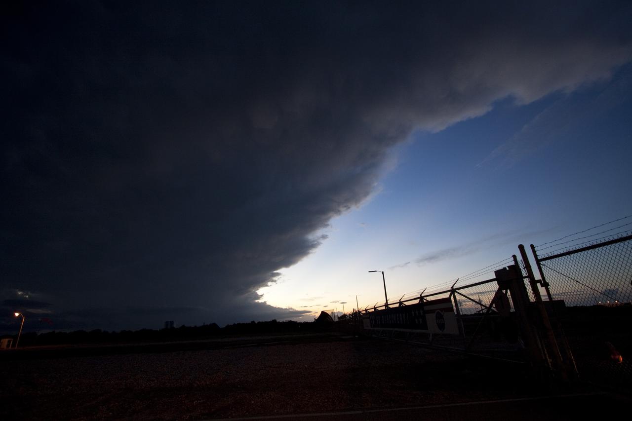 CAPE CANAVERAL, Fla. -- Storm clouds move over Launch Pad 39A at NASA's Kennedy Space Center in Florida, postponing the movement of the pad's rotating service structure away from space shuttle Discovery. The structure provides weather protection and access to the shuttle while it awaits lift off on the pad. RSS "rollback," as it's called, will begin again after the lightning-producing clouds pass. Launch of Discovery on the STS-133 mission to the International Space Station is set for 3:29 p.m. on Nov. 4. During the 11-day mission, Discovery and its six crew members will deliver the Permanent Multipurpose Module, packed with supplies and critical spare parts, as well as Robonaut 2, to the orbiting laboratory. Discovery, which will fly its 39th mission, is scheduled to be retired following STS-133. This will be the 133rd Space Shuttle Program mission and the 35th shuttle voyage to the space station. For more information on STS-133, visit www.nasa.gov/mission_pages/shuttle/shuttlemissions/sts133/. Photo credit: NASA/Jack Pfaller