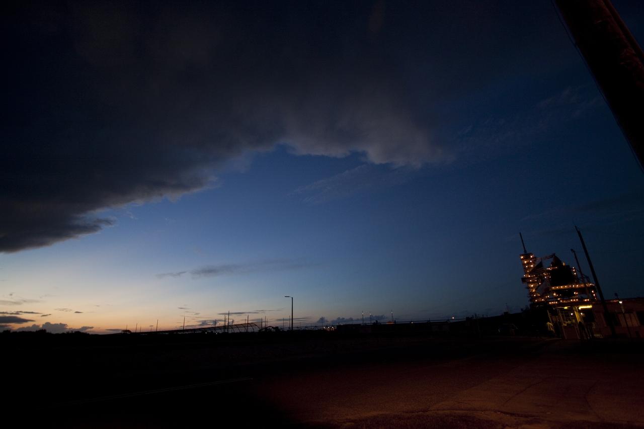 CAPE CANAVERAL, Fla. -- Storm clouds move over Launch Pad 39A at NASA's Kennedy Space Center in Florida, postponing the movement of the pad's rotating service structure away from space shuttle Discovery. The structure provides weather protection and access to the shuttle while it awaits lift off on the pad. RSS "rollback," as it's called, will begin again after the lightning-producing clouds pass. Launch of Discovery on the STS-133 mission to the International Space Station is set for 3:29 p.m. on Nov. 4. During the 11-day mission, Discovery and its six crew members will deliver the Permanent Multipurpose Module, packed with supplies and critical spare parts, as well as Robonaut 2, to the orbiting laboratory. Discovery, which will fly its 39th mission, is scheduled to be retired following STS-133. This will be the 133rd Space Shuttle Program mission and the 35th shuttle voyage to the space station. For more information on STS-133, visit www.nasa.gov/mission_pages/shuttle/shuttlemissions/sts133/. Photo credit: NASA/Jack Pfaller