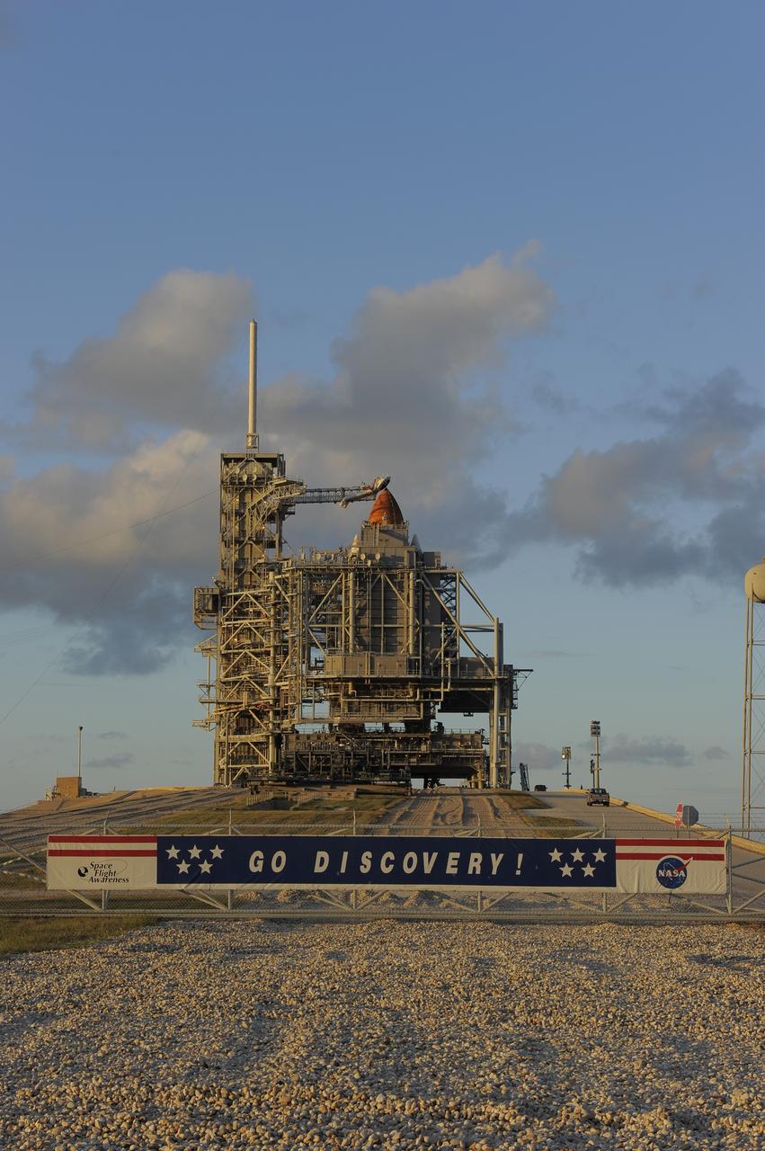 CAPE CANAVERAL, Fla. -- Before the sun sets on Launch Pad 39A at NASA's Kennedy Space Center in Florida, space shuttle Discovery is concealed by the pad's rotating service structure. The structure provides weather protection and access to the shuttle. RSS "rollback," as it's called, is a significant milestone in the launch countdown. Launch of Discovery on the STS-133 mission to the International Space Station is set for 3:29 p.m. on Nov. 4. During the 11-day mission, Discovery and its six crew members will deliver the Permanent Multipurpose Module, packed with supplies and critical spare parts, as well as Robonaut 2, to the orbiting laboratory. Discovery, which will fly its 39th mission, is scheduled to be retired following STS-133. This will be the 133rd Space Shuttle Program mission and the 35th shuttle voyage to the space station. For more information on STS-133, visit www.nasa.gov/mission_pages/shuttle/shuttlemissions/sts133/. Photo credit: NASA/Kim Shiflett