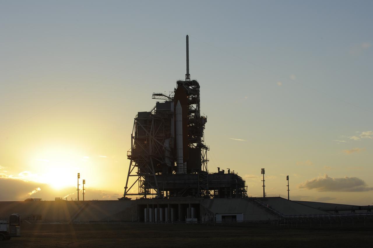 CAPE CANAVERAL, Fla. -- On Launch Pad 39A, preparations are under way to move the pad's rotating service structure away from space shuttle Discovery as the sun sets over NASA's Kennedy Space Center in Florida. The structure provides weather protection and access to the shuttle while it awaits lift off on the pad. RSS "rollback," as it's called, is a significant milestone in the launch countdown. Launch of Discovery on the STS-133 mission to the International Space Station is set for 3:29 p.m. on Nov. 4. During the 11-day mission, Discovery and its six crew members will deliver the Permanent Multipurpose Module, packed with supplies and critical spare parts, as well as Robonaut 2, to the orbiting laboratory. Discovery, which will fly its 39th mission, is scheduled to be retired following STS-133. This will be the 133rd Space Shuttle Program mission and the 35th shuttle voyage to the space station. For more information on STS-133, visit www.nasa.gov/mission_pages/shuttle/shuttlemissions/sts133/. Photo credit: NASA/Kim Shiflett