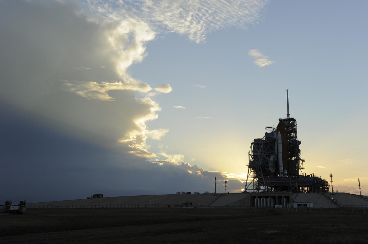 CAPE CANAVERAL, Fla. -- Storm clouds move in over Launch Pad 39A at NASA's Kennedy Space Center in Florida, postponing the retraction of the pad's rotating service structure, which would reveal space shuttle Discovery. The structure provides weather protection and access to the shuttle while it awaits lift off on the pad. RSS "rollback," as it's called, will begin again after the lightning-producing clouds pass. Launch of Discovery on the STS-133 mission to the International Space Station is set for 3:29 p.m. on Nov. 4. During the 11-day mission, Discovery and its six crew members will deliver the Permanent Multipurpose Module, packed with supplies and critical spare parts, as well as Robonaut 2, to the orbiting laboratory. Discovery, which will fly its 39th mission, is scheduled to be retired following STS-133. This will be the 133rd Space Shuttle Program mission and the 35th shuttle voyage to the space station. For more information on STS-133, visit www.nasa.gov/mission_pages/shuttle/shuttlemissions/sts133/. Photo credit: NASA/Kim Shiflett