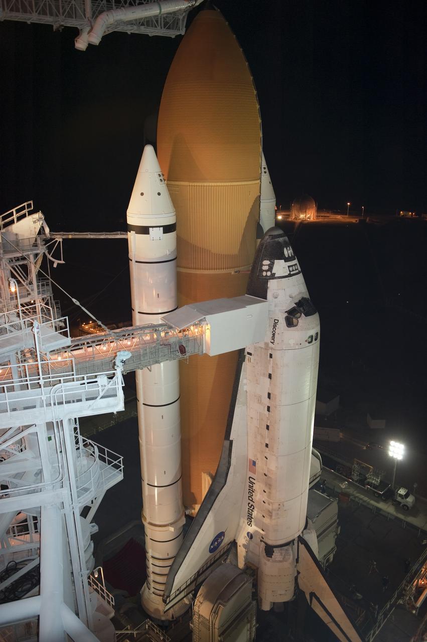 CAPE CANAVERAL, Fla. -- At NASA's Kennedy Space Center in Florida, space shuttle Discovery is visible on Launch Pad 39A following the retraction of the rotating service structure. The structure provides weather protection and access to the shuttle while it awaits lift off on the pad. RSS "rollback," as it's called, was delayed for a few hours to allow a lightning-producing storm cloud to pass. Launch of Discovery on the STS-133 mission to the International Space Station is set for 3:29 p.m. on Nov. 4. During the 11-day mission, Discovery and its six crew members will deliver the Permanent Multipurpose Module, packed with supplies and critical spare parts, as well as Robonaut 2, to the orbiting laboratory. Discovery, which will fly its 39th mission, is scheduled to be retired following STS-133. This will be the 133rd Space Shuttle Program mission and the 35th shuttle voyage to the space station. For more information on STS-133, visit www.nasa.gov/mission_pages/shuttle/shuttlemissions/sts133/. Photo credit: NASA/Kim Shiflett