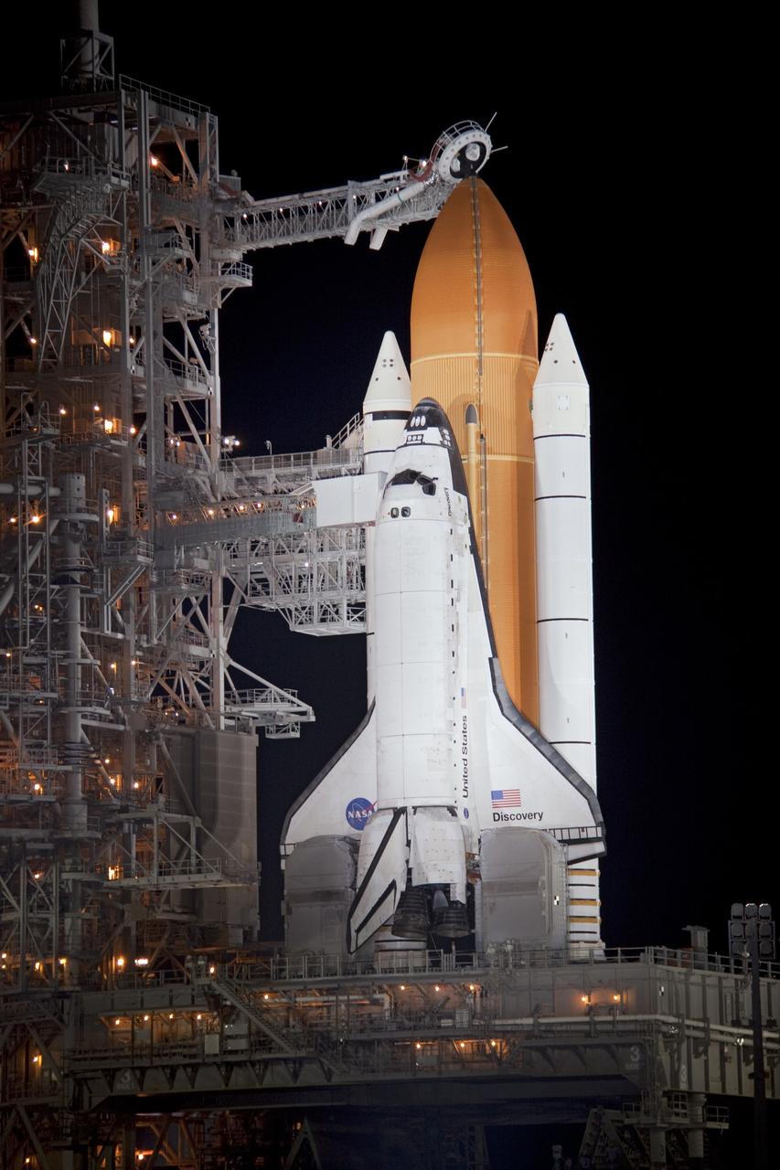 CAPE CANAVERAL, Fla. -- At NASA's Kennedy Space Center in Florida, xenon lights illuminate space shuttle Discovery on Launch Pad 39A following the retraction of the rotating service structure. The structure provides weather protection and access to the shuttle while it awaits lift off on the pad. Launch of Discovery on the STS-133 mission to the International Space Station is set for 3:29 p.m. on Nov. 4. During the 11-day mission, Discovery and its six crew members will deliver the Permanent Multipurpose Module, packed with supplies and critical spare parts, as well as Robonaut 2, to the orbiting laboratory. Discovery, which will fly its 39th mission, is scheduled to be retired following STS-133. This will be the 133rd Space Shuttle Program mission and the 35th shuttle voyage to the space station. For more information on STS-133, visit www.nasa.gov/mission_pages/shuttle/shuttlemissions/sts133/. Photo credit: NASA/Troy Cryder