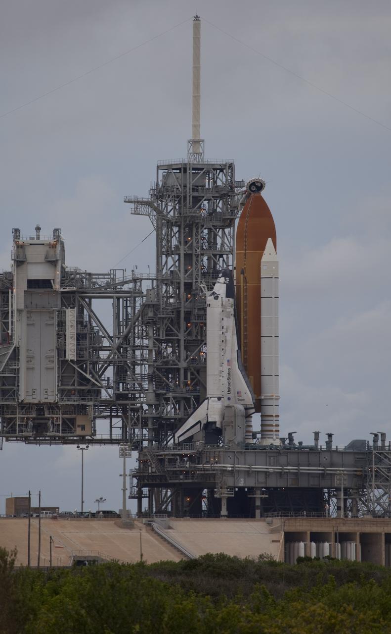 CAPE CANAVERAL, Fla. -- At NASA's Kennedy Space Center in Florida, space shuttle Discovery waits patiently on Launch Pad 39A for its STS-133 launch to the International Space Station. A cold front that was predicted to produce rain, wind and a low-cloud ceiling as it moved through the sunshine state delayed launch by one day. Lift off now is set for 3:04 p.m. on Nov. 5.        During the 11-day mission, Discovery and its six crew members will deliver the Permanent Multipurpose Module, packed with supplies and critical spare parts, as well as Robonaut 2, to the orbiting laboratory. Discovery, which will fly its 39th mission, is scheduled to be retired following STS-133. This will be the 133rd Space Shuttle Program mission and the 35th shuttle voyage to the space station. For more information on STS-133, visit www.nasa.gov/mission_pages/shuttle/shuttlemissions/sts133/. Photo credit: NASA/Frank Michaux