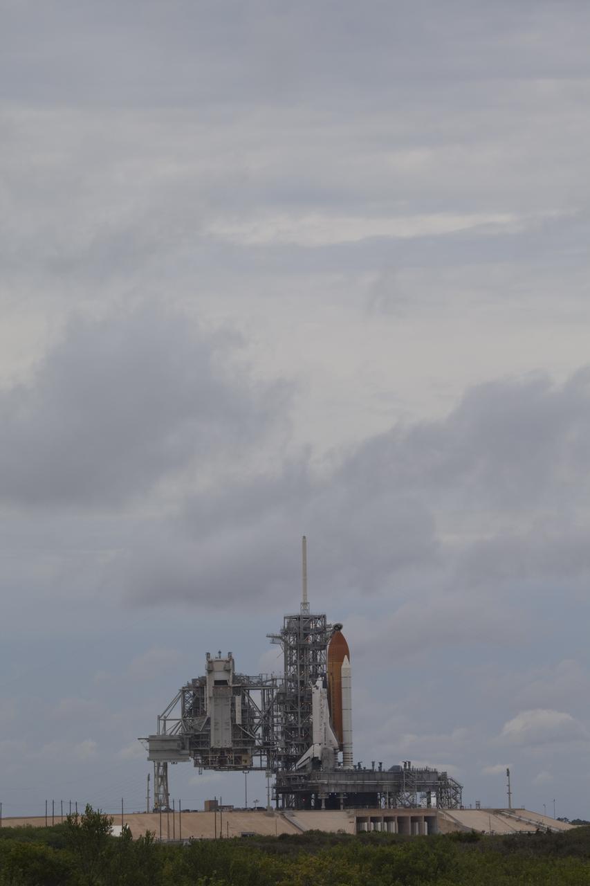 CAPE CANAVERAL, Fla. -- At NASA's Kennedy Space Center in Florida, space shuttle Discovery waits patiently on Launch Pad 39A for its STS-133 launch to the International Space Station. A cold front that was predicted to produce rain, wind and a low-cloud ceiling as it moved through the sunshine state delayed launch by one day. Lift off now is set for 3:04 p.m. on Nov. 5.        During the 11-day mission, Discovery and its six crew members will deliver the Permanent Multipurpose Module, packed with supplies and critical spare parts, as well as Robonaut 2, to the orbiting laboratory. Discovery, which will fly its 39th mission, is scheduled to be retired following STS-133. This will be the 133rd Space Shuttle Program mission and the 35th shuttle voyage to the space station. For more information on STS-133, visit www.nasa.gov/mission_pages/shuttle/shuttlemissions/sts133/. Photo credit: NASA/Frank Michaux