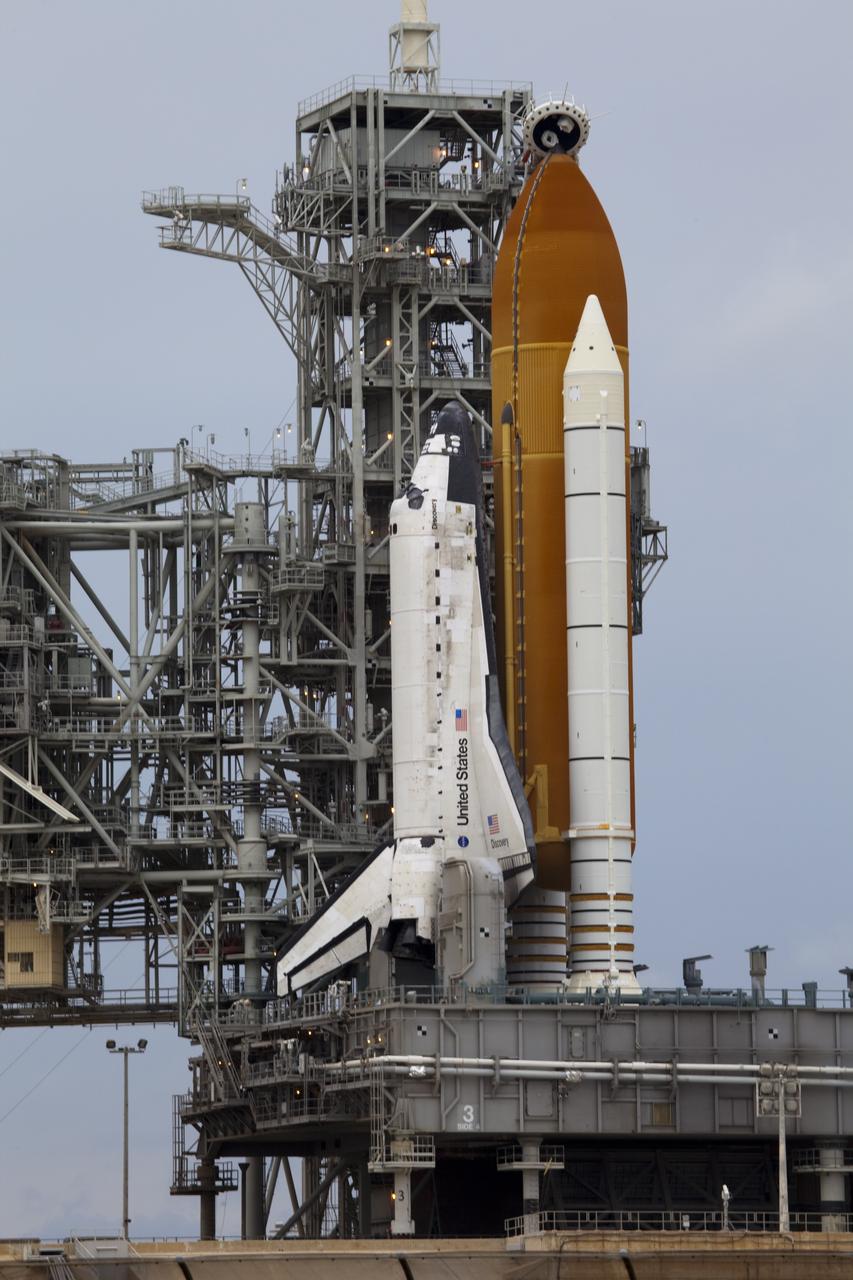 CAPE CANAVERAL, Fla. -- At NASA's Kennedy Space Center in Florida, space shuttle Discovery waits patiently on Launch Pad 39A for its STS-133 launch to the International Space Station. A cold front that was predicted to produce rain, wind and a low-cloud ceiling as it moved through the sunshine state delayed launch by one day. Lift off now is set for 3:04 p.m. on Nov. 5.        During the 11-day mission, Discovery and its six crew members will deliver the Permanent Multipurpose Module, packed with supplies and critical spare parts, as well as Robonaut 2, to the orbiting laboratory. Discovery, which will fly its 39th mission, is scheduled to be retired following STS-133. This will be the 133rd Space Shuttle Program mission and the 35th shuttle voyage to the space station. For more information on STS-133, visit www.nasa.gov/mission_pages/shuttle/shuttlemissions/sts133/. Photo credit: NASA/Frank Michaux