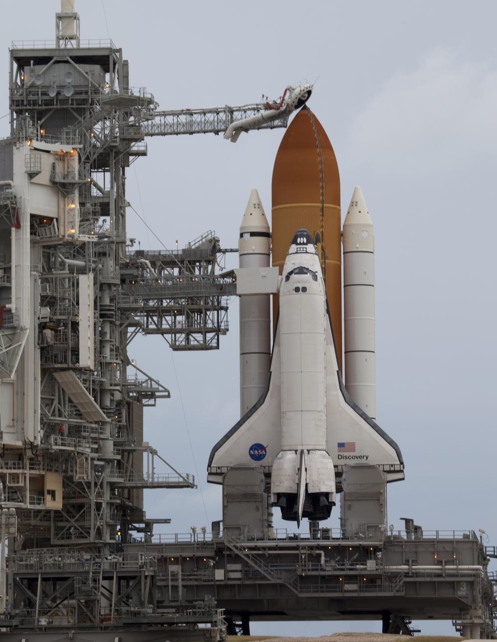 CAPE CANAVERAL, Fla. -- At NASA's Kennedy Space Center in Florida, space shuttle Discovery waits patiently on Launch Pad 39A for its STS-133 launch to the International Space Station. A cold front that was predicted to produce rain, wind and a low-cloud ceiling as it moved through the sunshine state delayed launch by one day. Lift off now is set for 3:04 p.m. on Nov. 5.        During the 11-day mission, Discovery and its six crew members will deliver the Permanent Multipurpose Module, packed with supplies and critical spare parts, as well as Robonaut 2, to the orbiting laboratory. Discovery, which will fly its 39th mission, is scheduled to be retired following STS-133. This will be the 133rd Space Shuttle Program mission and the 35th shuttle voyage to the space station. For more information on STS-133, visit www.nasa.gov/mission_pages/shuttle/shuttlemissions/sts133/. Photo credit: NASA/Frank Michaux