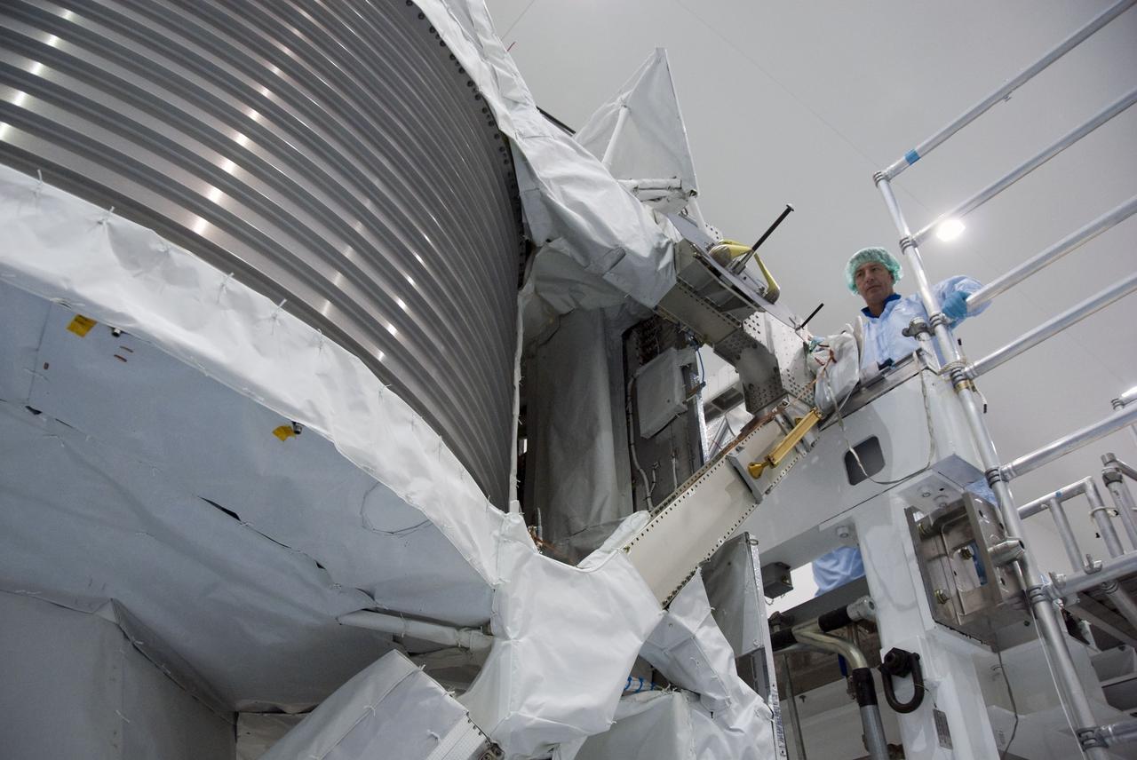 CAPE CANAVERAL, Fla. -- In the Space Station Processing Facility at NASA's Kennedy Space Center in Florida, STS-134 Mission Specialist Roberto Vittori, with the European Space Agency, inspects the Alpha Magnetic Spectrometer-2 (AMS). Vittori and his five crewmates are at Kennedy participating in the Crew Equipment Interface Test (CEIT), which gives them an opportunity for hands-on training with tools they'll be using in space and familiarization of the payload they'll be delivering to the International Space Station.               Space shuttle Endeavour is targeted to launch on the STS-134 mission Feb. 27, 2011. For more information, visit www.nasa.gov/mission_pages/shuttle/shuttlemissions/sts134/index.html. Photo credit: NASA/Cory Huston