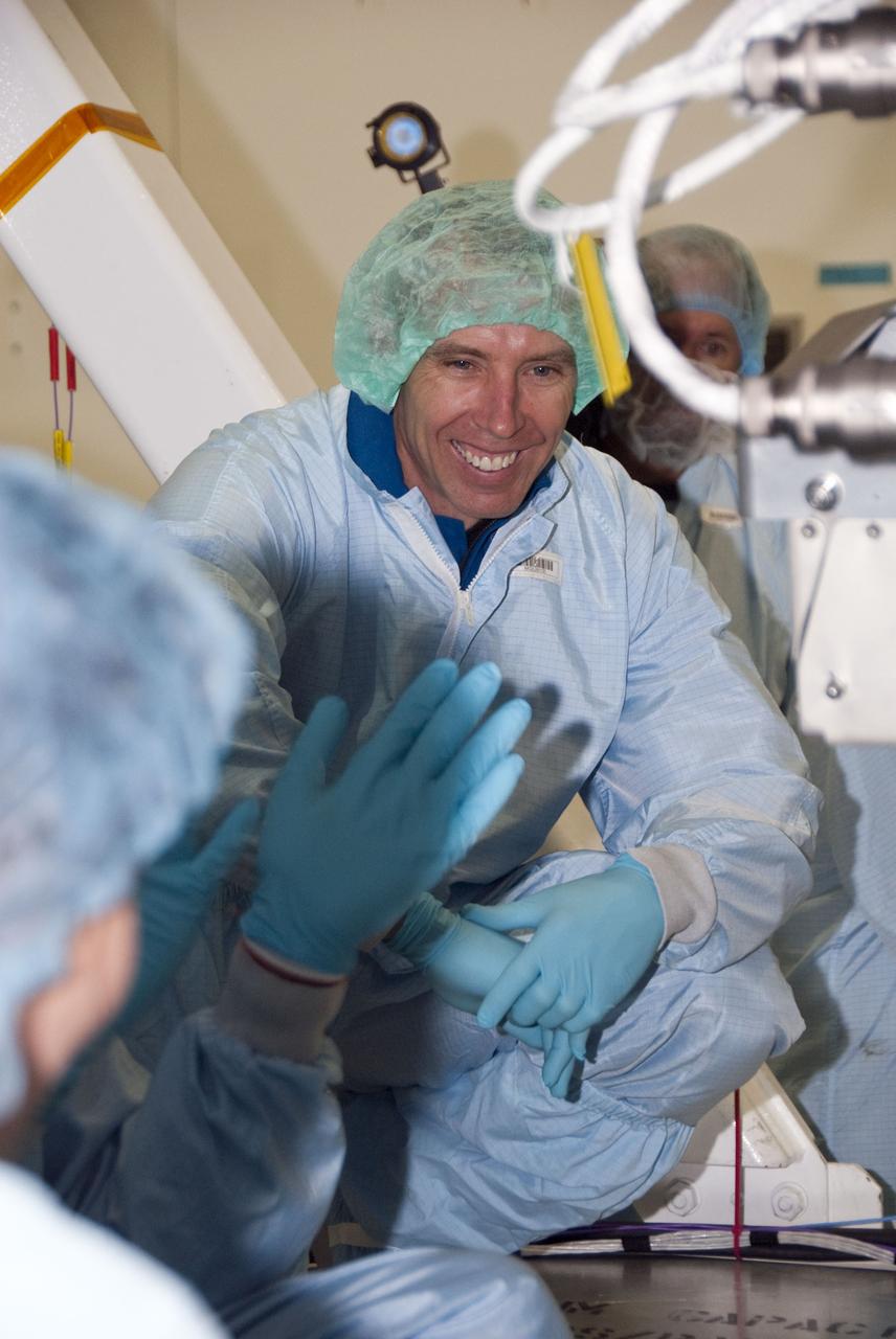 CAPE CANAVERAL, Fla. -- In the Space Station Processing Facility at NASA's Kennedy Space Center in Florida, STS-134 Mission Specialist Andrew Feustel inspects the Alpha Magnetic Spectrometer-2 (AMS) with the experiment's technicians. Feustel and his five crewmates are at Kennedy participating in the Crew Equipment Interface Test (CEIT), which gives them an opportunity for hands-on training with tools they'll be using in space and familiarization of the payload they'll be delivering to the International Space Station.             Space shuttle Endeavour is targeted to launch on the STS-134 mission Feb. 27, 2011. For more information, visit www.nasa.gov/mission_pages/shuttle/shuttlemissions/sts134/index.html. Photo credit: NASA/Cory Huston
