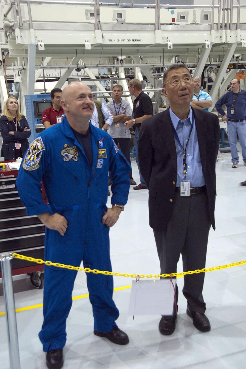 CAPE CANAVERAL, Fla. -- In the Space Station Processing Facility at NASA's Kennedy Space Center in Florida, STS-134 Commander Mark Kelly, front left, checks out the Alpha Magnetic Spectrometer-2 (AMS) with the experiment's principal investigator, Prof. Samuel Ting. Kelly and his five crewmates are at Kennedy participating in the Crew Equipment Interface Test (CEIT), which gives them an opportunity for hands-on training with tools they'll be using in space and familiarization of the payload they'll be delivering to the International Space Station.               Space shuttle Endeavour is targeted to launch on the STS-134 mission Feb. 27, 2011. For more information, visit www.nasa.gov/mission_pages/shuttle/shuttlemissions/sts134/index.html. Photo credit: NASA/Cory Huston