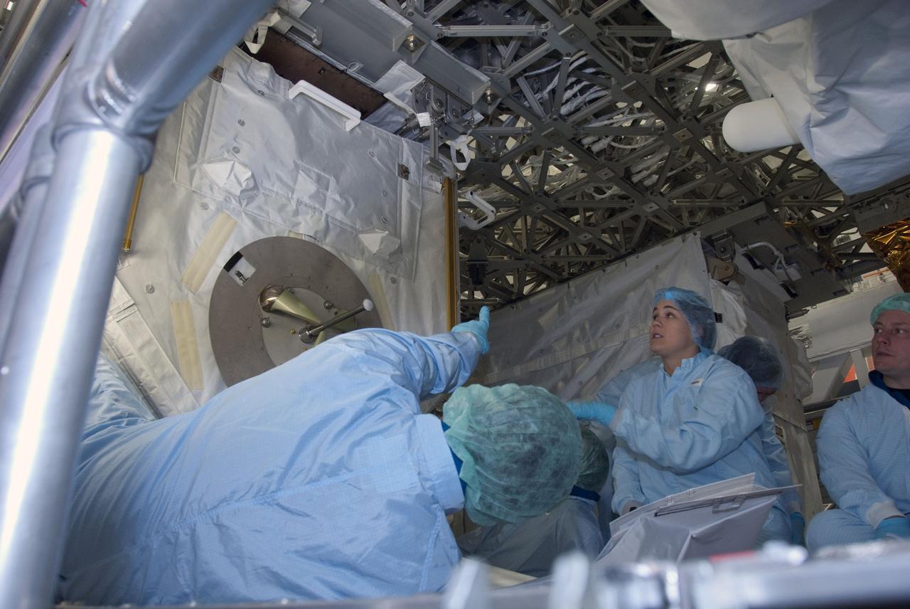 CAPE CANAVERAL, Fla. -- In the Space Station Processing Facility at NASA's Kennedy Space Center in Florida, STS-134 crew members inspect the Express Logistics Carrier-3 with the carrier's technicians. The six-member crew is at Kennedy participating in the Crew Equipment Interface Test (CEIT), which gives them an opportunity for hands-on training with tools they'll be using in space and familiarization of the payload they'll be delivering to the International Space Station.               Space shuttle Endeavour is targeted to launch on the STS-134 mission Feb. 27, 2011. For more information, visit www.nasa.gov/mission_pages/shuttle/shuttlemissions/sts134/index.html. Photo credit: NASA/Cory Huston