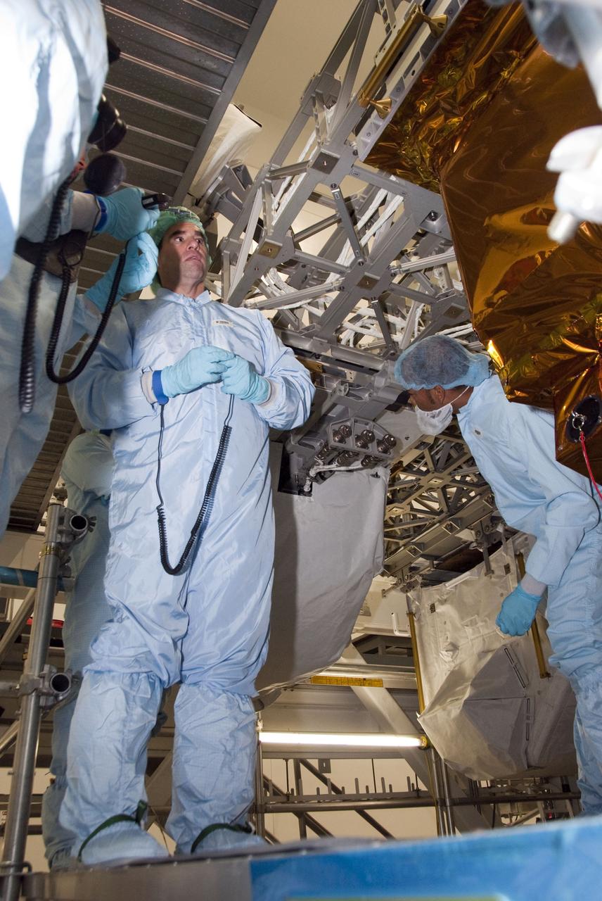 CAPE CANAVERAL, Fla. -- In the Space Station Processing Facility at NASA's Kennedy Space Center in Florida, STS-134 Mission Specialist Greg Chamitoff, center, inspects the Express Logistics Carrier-3 with the carrier's technicians. Chamitoff and his five crewmates are at Kennedy participating in the Crew Equipment Interface Test (CEIT), which gives them an opportunity for hands-on training with tools they'll be using in space and familiarization of the payload they'll be delivering to the International Space Station.               Space shuttle Endeavour is targeted to launch on the STS-134 mission Feb. 27, 2011. For more information, visit www.nasa.gov/mission_pages/shuttle/shuttlemissions/sts134/index.html. Photo credit: NASA/Cory Huston