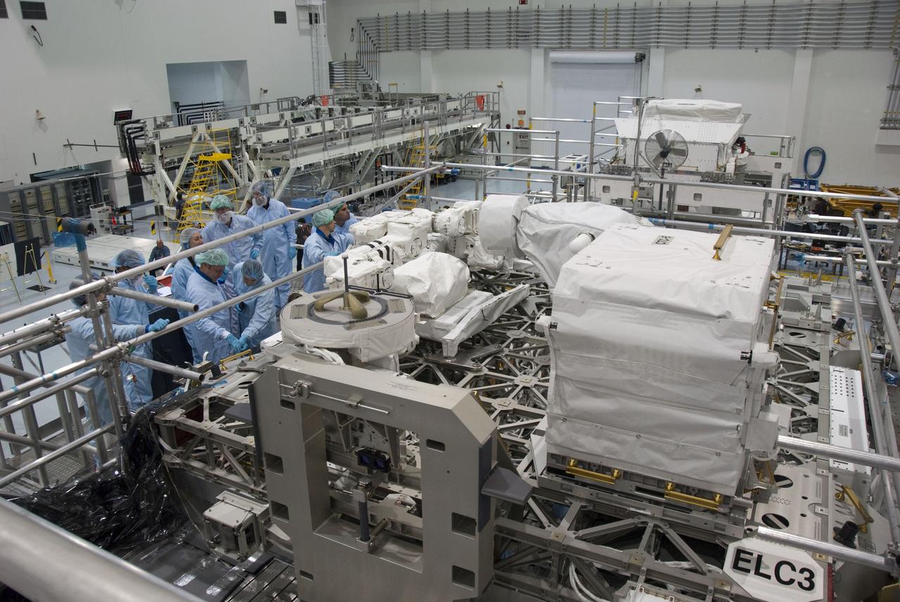 CAPE CANAVERAL, Fla. -- In the Space Station Processing Facility at NASA's Kennedy Space Center in Florida, STS-134 crew members inspect the Express Logistics Carrier-3 with the carrier's technicians. The six-member crew is at Kennedy participating in the Crew Equipment Interface Test (CEIT), which gives them an opportunity for hands-on training with tools they'll be using in space and familiarization of the payload they'll be delivering to the International Space Station.              Space shuttle Endeavour is targeted to launch on the STS-134 mission Feb. 27, 2011. For more information, visit www.nasa.gov/mission_pages/shuttle/shuttlemissions/sts134/index.html. Photo credit: NASA/Cory Huston