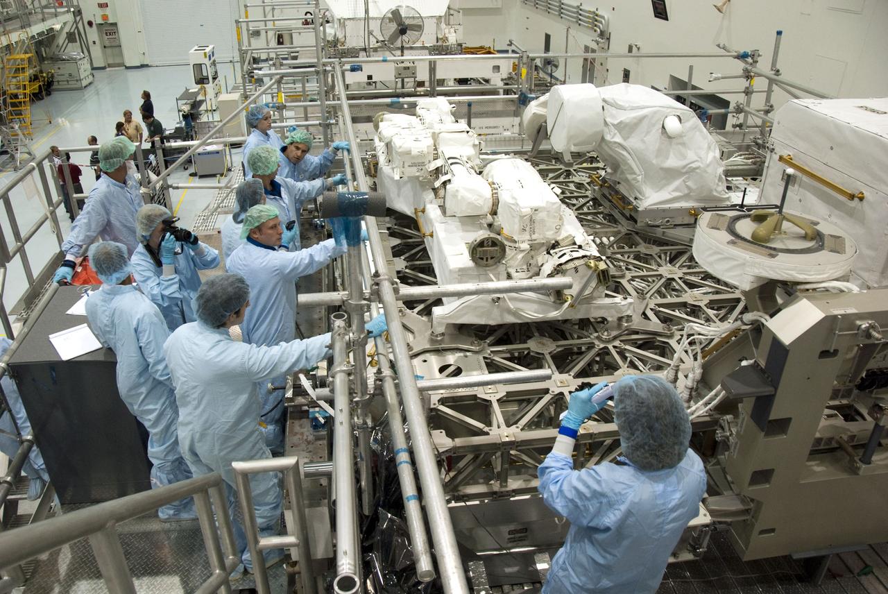 CAPE CANAVERAL, Fla. -- In the Space Station Processing Facility at NASA's Kennedy Space Center in Florida, STS-134 crew members inspect the Express Logistics Carrier-3 with the carrier's technicians. The six-member crew is at Kennedy participating in the Crew Equipment Interface Test (CEIT), which gives them an opportunity for hands-on training with tools they'll be using in space and familiarization of the payload they'll be delivering to the International Space Station.              Space shuttle Endeavour is targeted to launch on the STS-134 mission Feb. 27, 2011. For more information, visit www.nasa.gov/mission_pages/shuttle/shuttlemissions/sts134/index.html. Photo credit: NASA/Cory Huston