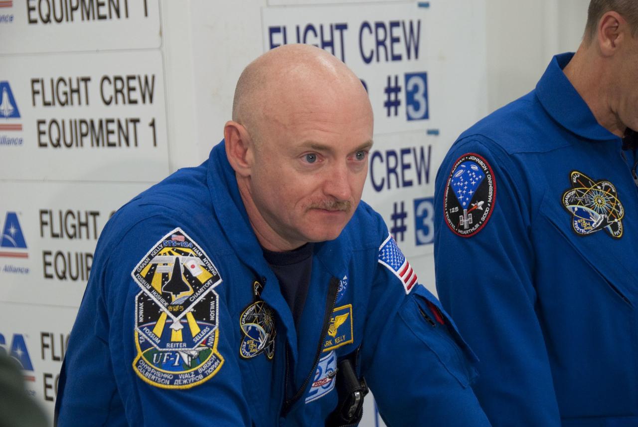 CAPE CANAVERAL, Fla. -- In the Space Station Processing Facility at NASA's Kennedy Space Center in Florida, STS-134 Commander Mark Kelly checks out some of the tools and equipment he'll be using in space. The six-member crew is at Kennedy participating in the Crew Equipment Interface Test (CEIT), which gives them an opportunity for hands-on training and familiarization of the payload they'll be delivering to the International Space Station.                Space shuttle Endeavour is targeted to launch on the STS-134 mission Feb. 27, 2011. For more information, visit www.nasa.gov/mission_pages/shuttle/shuttlemissions/sts134/index.html. Photo credit: NASA/Cory Huston