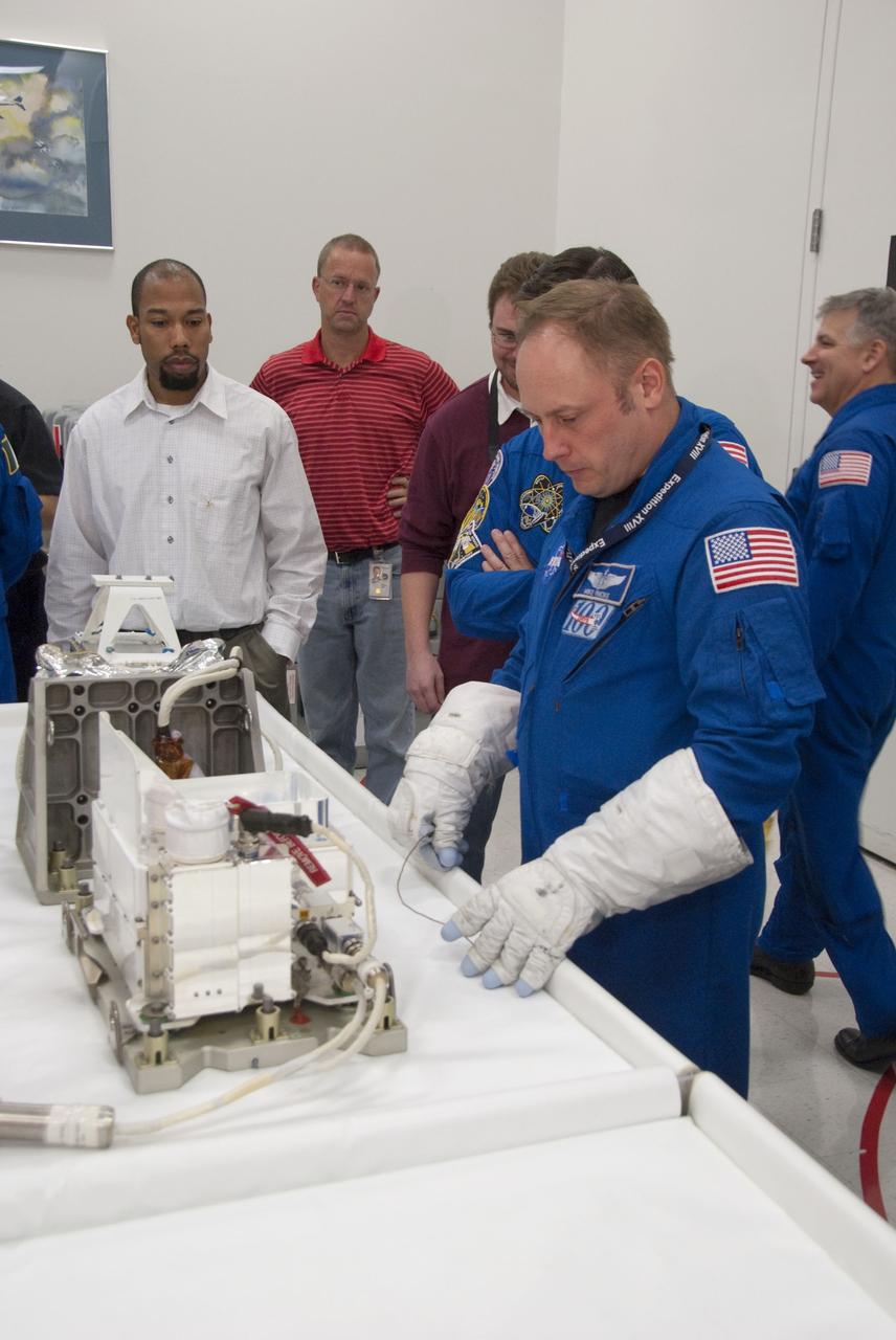 CAPE CANAVERAL, Fla. -- In the Space Station Processing Facility at NASA's Kennedy Space Center in Florida, STS-134 Mission Specialist Michael Finke checks out some of the tools and equipment he'll be using in space. The six-member crew is at Kennedy participating in the Crew Equipment Interface Test (CEIT), which gives them an opportunity for hands-on training and familiarization of the payload they'll be delivering to the International Space Station.                 Space shuttle Endeavour is targeted to launch on the STS-134 mission Feb. 27, 2011. For more information, visit www.nasa.gov/mission_pages/shuttle/shuttlemissions/sts134/index.html. Photo credit: NASA/Cory Huston