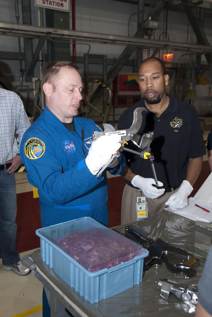CAPE CANAVERAL, Fla. -- In the Orbiter Processing Facility-2 at NASA's Kennedy Space Center in Florida, STS-134 Mission Specialist Michael Finke check outs tools and equipment he'll be using in space. The six STS-134 astronauts are at Kennedy participating in the Crew Equipment Interface Test (CEIT), which gives them an opportunity for hands-on training and familiarization of the payload they'll be delivering to the International Space Station. Space shuttle Endeavour is targeted to launch on the STS-134 mission Feb. 27, 2011. For more information, visit www.nasa.gov/mission_pages/shuttle/shuttlemissions/sts134/index.html. Photo credit: NASA/Cory Huston
