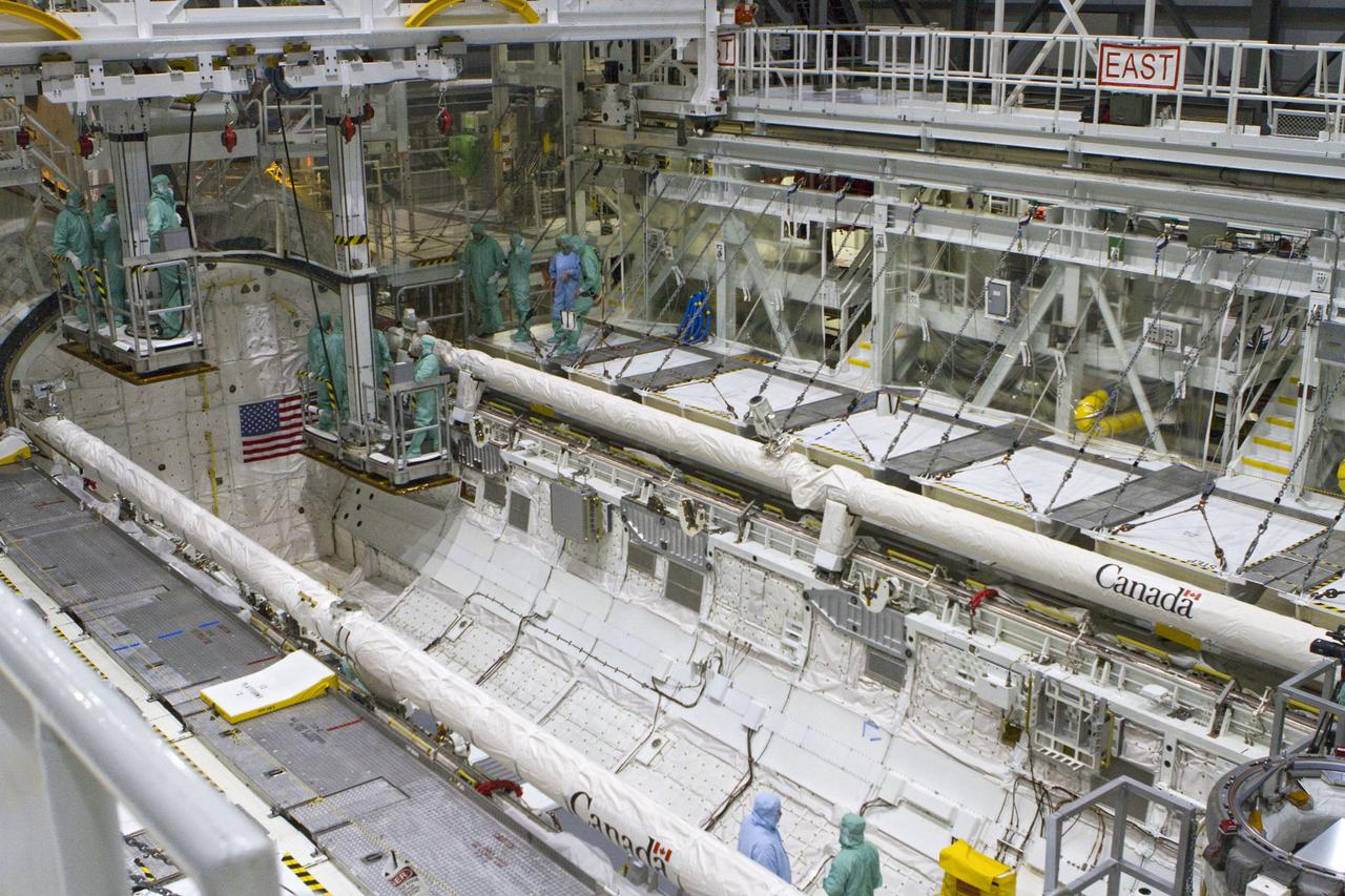 CAPE CANAVERAL, Fla. -- In Orbiter Processing Facility-2 at NASA's Kennedy Space Center in Florida, the STS-134 crew and technicians check space shuttle Endeavour's payload bay for sharp edges that could affect the astronauts' work in space. The six STS-134 astronauts are participating in the Crew Equipment Interface Test (CEIT), which gives them an opportunity for hands-on training with the tools and equipment they'll use in space and familiarization of the payload they'll be delivering to the International Space Station.       Endeavour is targeted to launch on the STS-134 mission Feb. 27, 2011. For more information, visit www.nasa.gov/mission_pages/shuttle/shuttlemissions/sts134/index.html. Photo credit: NASA/Cory Huston and Glenn Benson