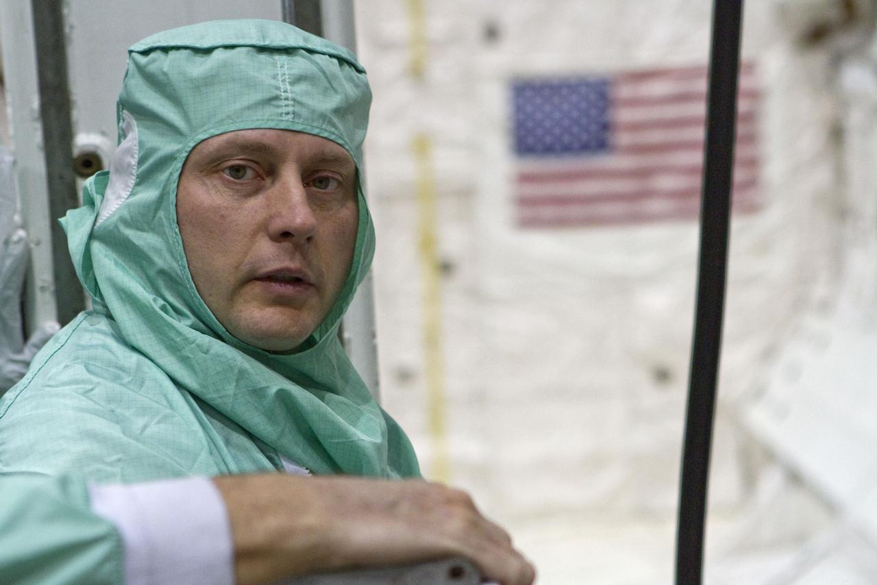 CAPE CANAVERAL, Fla. -- In Orbiter Processing Facility-2 at NASA's Kennedy Space Center in Florida, STS-134 Mission Specialist Michael Finke checks space shuttle Endeavour's payload bay for sharp edges that could affect his work in space. The six STS-134 astronauts are participating in the Crew Equipment Interface Test (CEIT), which gives them an opportunity for hands-on training with the tools and equipment they'll use in space and familiarization of the payload they'll be delivering to the International Space Station.     Endeavour is targeted to launch on the STS-134 mission Feb. 27, 2011. For more information, visit www.nasa.gov/mission_pages/shuttle/shuttlemissions/sts134/index.html. Photo credit: NASA/Cory Huston and Glenn Benson