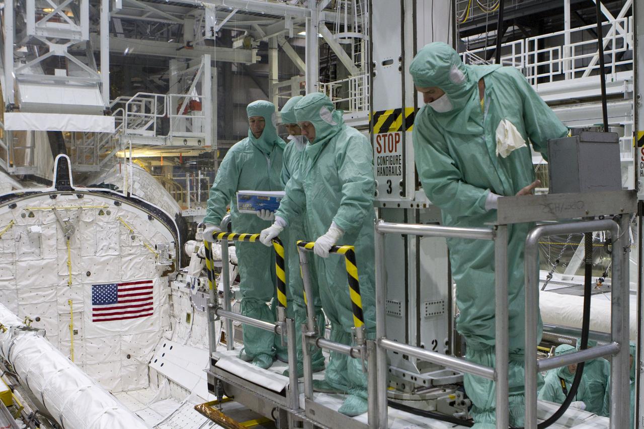 CAPE CANAVERAL, Fla. -- In Orbiter Processing Facility-2 at NASA's Kennedy Space Center in Florida, the STS-134 crew and technicians check space shuttle Endeavour's payload bay for sharp edges that could affect the astronauts' work in space. Seen here, from left, are Mission Specialist Roberto Vittori with the European Space Agency, a technician, Mission Specialist Michael Finke, and another technician. The six STS-134 astronauts are participating in the Crew Equipment Interface Test (CEIT), which gives them an opportunity for hands-on training with the tools and equipment they'll use in space and familiarization of the payload they'll be delivering to the International Space Station.       Endeavour is targeted to launch on the STS-134 mission Feb. 27, 2011. For more information, visit www.nasa.gov/mission_pages/shuttle/shuttlemissions/sts134/index.html. Photo credit: NASA/Cory Huston and Glenn Benson