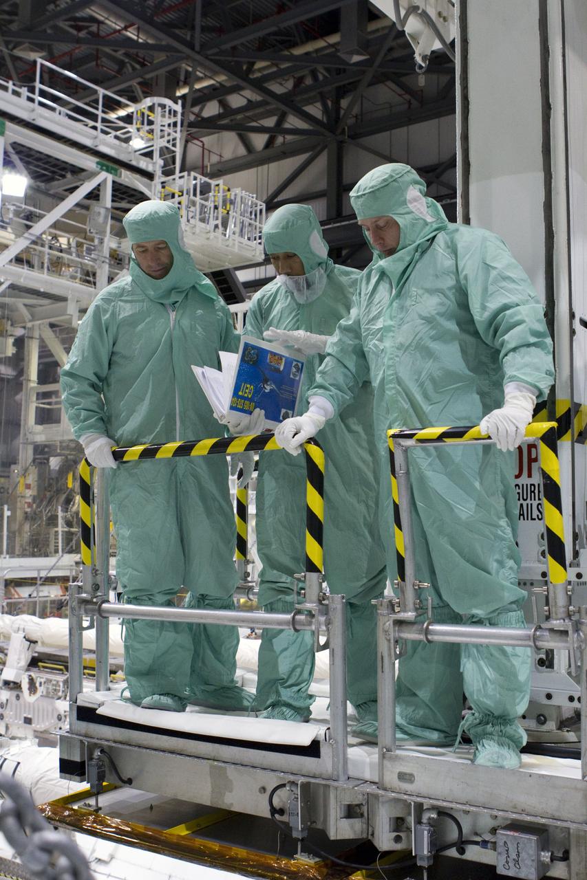 CAPE CANAVERAL, Fla. -- In Orbiter Processing Facility-2 at NASA's Kennedy Space Center in Florida, the STS-134 crew and technicians check space shuttle Endeavour's payload bay for sharp edges that could affect the astronauts' work in space. Seen here, from left, are Mission Specialist Roberto Vittori with the European Space Agency, a technician, and Mission Specialist Michael Finke. The six STS-134 astronauts are participating in the Crew Equipment Interface Test (CEIT), which gives them an opportunity for hands-on training with the tools and equipment they'll use in space and familiarization of the payload they'll be delivering to the International Space Station.     Endeavour is targeted to launch on the STS-134 mission Feb. 27, 2011. For more information, visit www.nasa.gov/mission_pages/shuttle/shuttlemissions/sts134/index.html. Photo credit: NASA/Cory Huston and Glenn Benson
