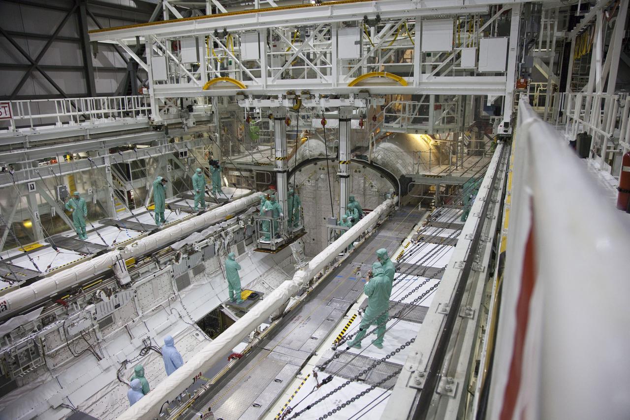 CAPE CANAVERAL, Fla. -- In the Orbiter Processing Facility-2 at NASA's Kennedy Space Center in Florida, the STS-134 crew and technicians check out space shuttle Endeavour's payload bay. The six STS-134 astronauts are participating in the Crew Equipment Interface Test (CEIT), which gives them an opportunity for hands-on training with the tools and equipment they'll use in space and familiarization of the payload they'll be delivering to the International Space Station.       Endeavour is targeted to launch on the STS-134 mission Feb. 27, 2011. For more information, visit www.nasa.gov/mission_pages/shuttle/shuttlemissions/sts134/index.html. Photo credit: NASA/Frankie Martin