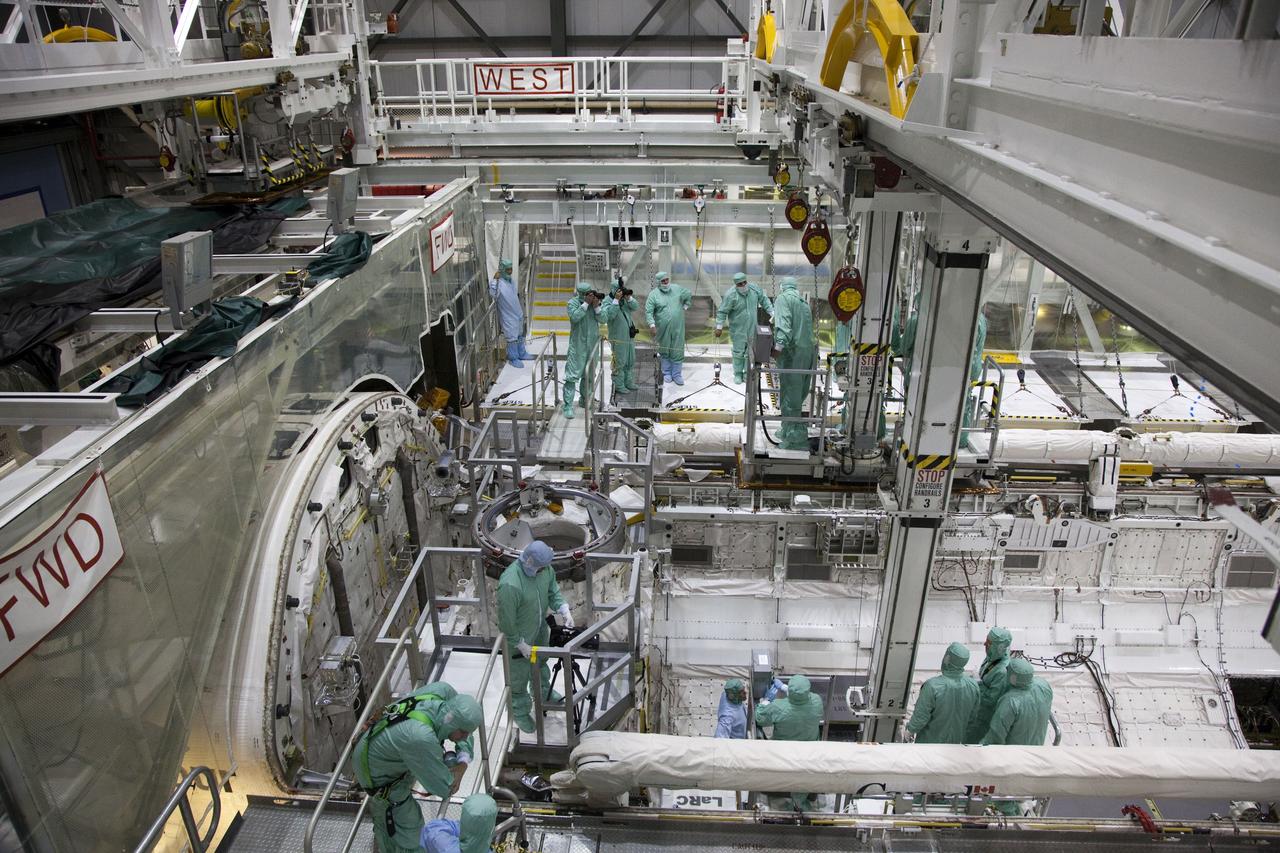 CAPE CANAVERAL, Fla. -- In the Orbiter Processing Facility-2 at NASA's Kennedy Space Center in Florida, the STS-134 crew and technicians check out space shuttle Endeavour's payload bay. The six STS-134 astronauts are participating in the Crew Equipment Interface Test (CEIT), which gives them an opportunity for hands-on training with the tools and equipment they'll use in space and familiarization of the payload they'll be delivering to the International Space Station.       Endeavour is targeted to launch on the STS-134 mission Feb. 27, 2011. For more information, visit www.nasa.gov/mission_pages/shuttle/shuttlemissions/sts134/index.html. Photo credit: NASA/Frankie Martin
