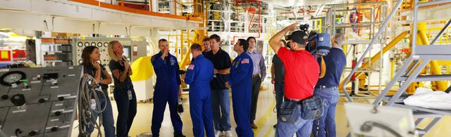 CAPE CANAVERAL, Fla. -- In the Orbiter Processing Facility-2 at NASA's Kennedy Space Center in Florida, STS-134 crew members hang out under the spacecraft that will take them to the International Space Station, space shuttle Endeavour. The six STS-134 astronauts are participating in the Crew Equipment Interface Test (CEIT), which gives them an opportunity for hands-on training and familiarization of the payload they'll be delivering to the orbiting laboratory.    Endeavour is targeted to launch on the STS-134 mission Feb. 27, 2011. For more information, visit www.nasa.gov/mission_pages/shuttle/shuttlemissions/sts134/index.html. Photo credit: NASA/Frankie Martin