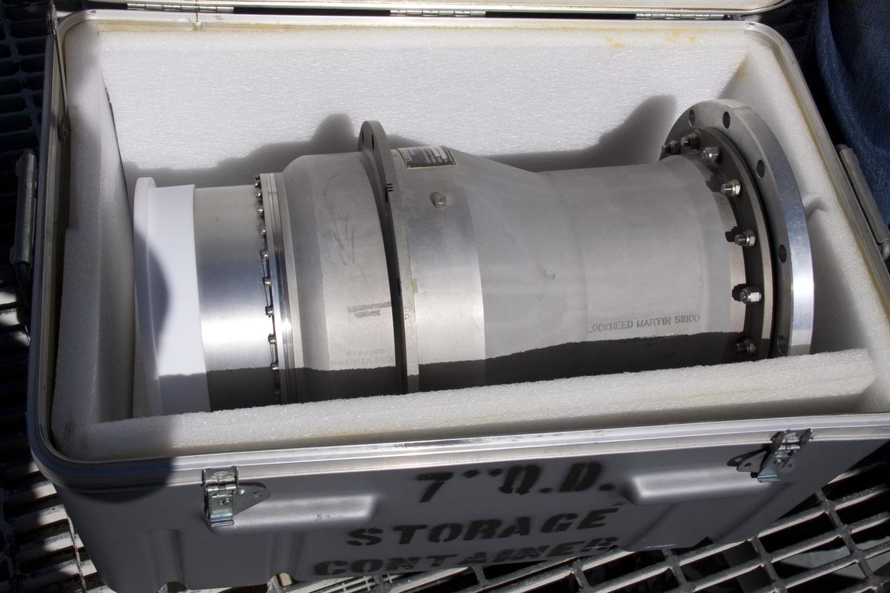 CAPE CANAVERAL, Fla. -- On Launch Pad 39A at NASA's Kennedy Space Center in Florida, workers take photos of the ground umbilical carrier plate's (GUCP) 7-inch quick disconnect, which has been removed from the external fuel tank. A hydrogen gas leak at that location during tanking for space shuttle Discovery's STS-133 mission to the International Space Station caused the launch attempt to be scrubbed Nov. 5. The GUCP will be examined to determine the cause of the hydrogen leak and then repaired. The GUCP is the overboard vent to the pad and the flame stack where the vented hydrogen is burned off. Discovery's next launch attempt is no earlier than Nov. 30 at 4:02 a.m. EST. For more information on STS-133, visit www.nasa.gov/mission_pages/shuttle/shuttlemissions/sts133/. Photo credit: NASA/Troy Cryder