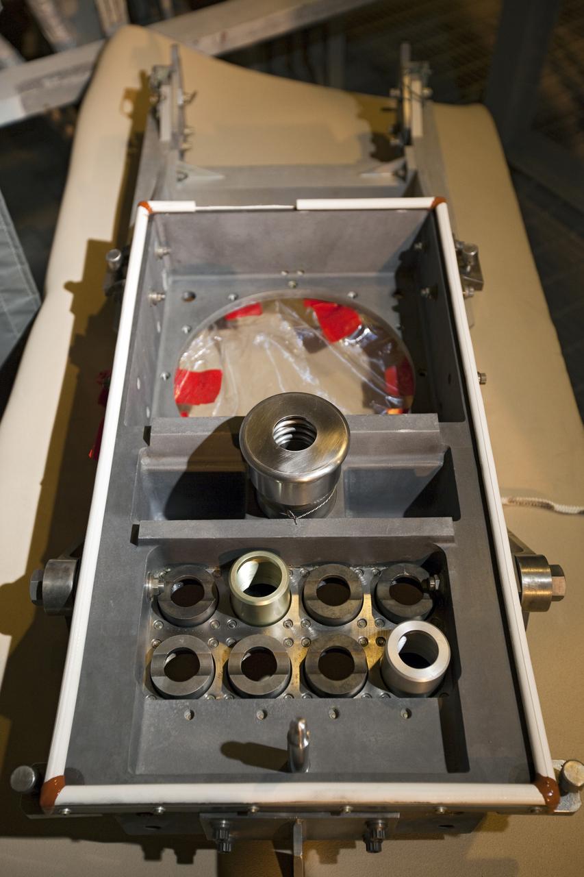 CAPE CANAVERAL, Fla. -- On Launch Pad 39A at NASA's Kennedy Space Center in Florida, the ground umbilical carrier plate (GUCP) is ready to be examined. A hydrogen gas leak at that location on the external fuel tank during tanking for space shuttle Discovery's STS-133 mission to the International Space Station caused the launch attempt to be scrubbed Nov. 5. The GUCP will be examined to determine the cause of the hydrogen leak and then repaired. The GUCP is the overboard vent to the pad and the flame stack where the excess hydrogen is burned off.       For more information on STS-133, visit www.nasa.gov/mission_pages/shuttle/shuttlemissions/sts133/. Photo credit: NASA/Dimitri Gerondidakis