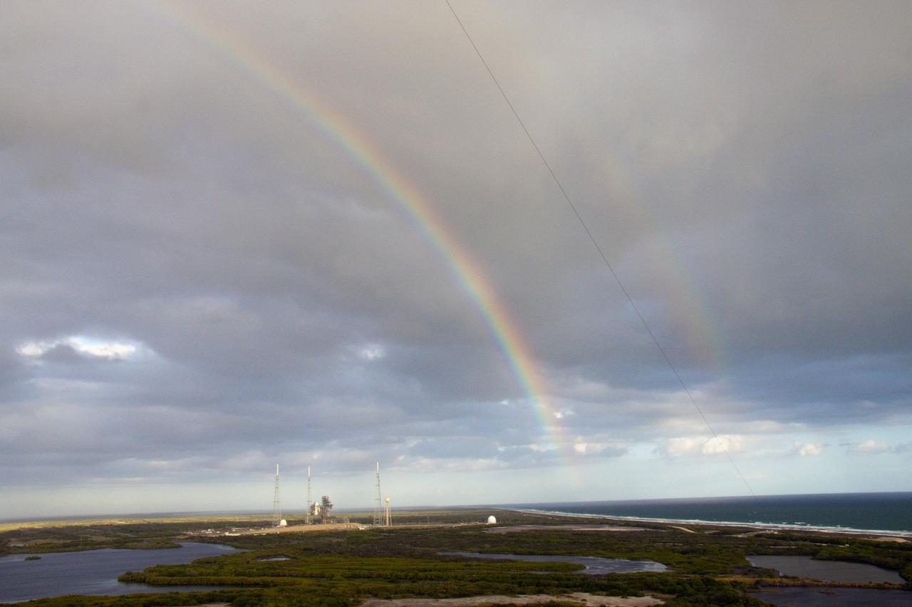CAPE CANAVERAL, Fla. -- At NASA's Kennedy Space Center in Florida, two rainbows appear between Launch Pad 39B and Launch Pad 39A. Pad B, seen here, is morphing to support a commercial space program with multiple customers, multiple providers and multiple systems that will take Americans to the International Space Station and other low Earth orbit destinations. For information on NASA's future plans, visit www.nasa.gov. Photo credit: NASA/Troy Cryder
