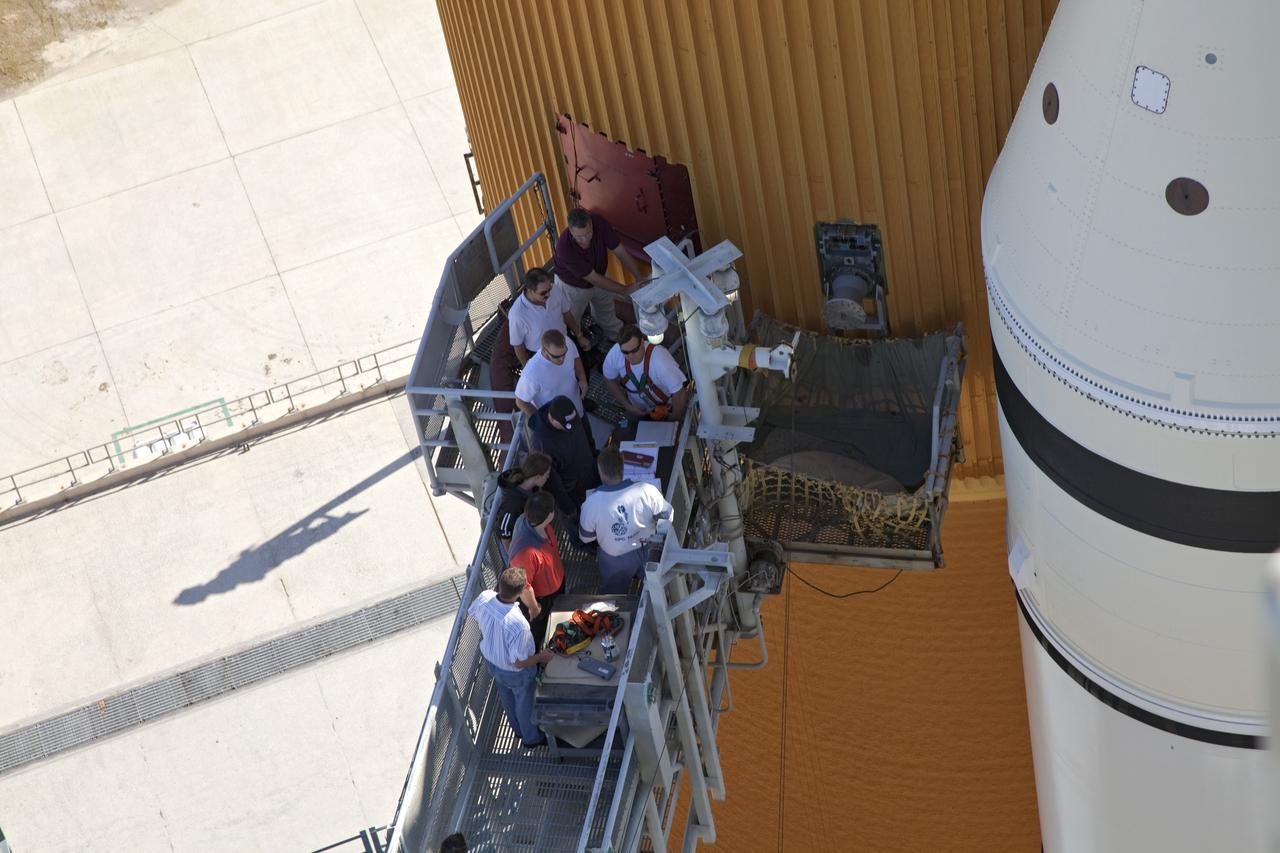 CAPE CANAVERAL, Fla. -- On Launch Pad 39A at NASA's Kennedy Space Center in Florida, a new 7-inch quick disconnect is installed on the ground umbilical carrier plate (GUCP) of space shuttle Discovery's external fuel tank. A hydrogen gas leak at that location during tanking for Discovery's STS-133 mission to the International Space Station caused the launch attempt to be scrubbed Nov. 5. The GUCP is the overboard vent to the pad and the flame stack where the excess hydrogen is burned off.       For more information on STS-133, visit www.nasa.gov/mission_pages/shuttle/shuttlemissions/sts133/. Photo credit: NASA/Frankie Martin