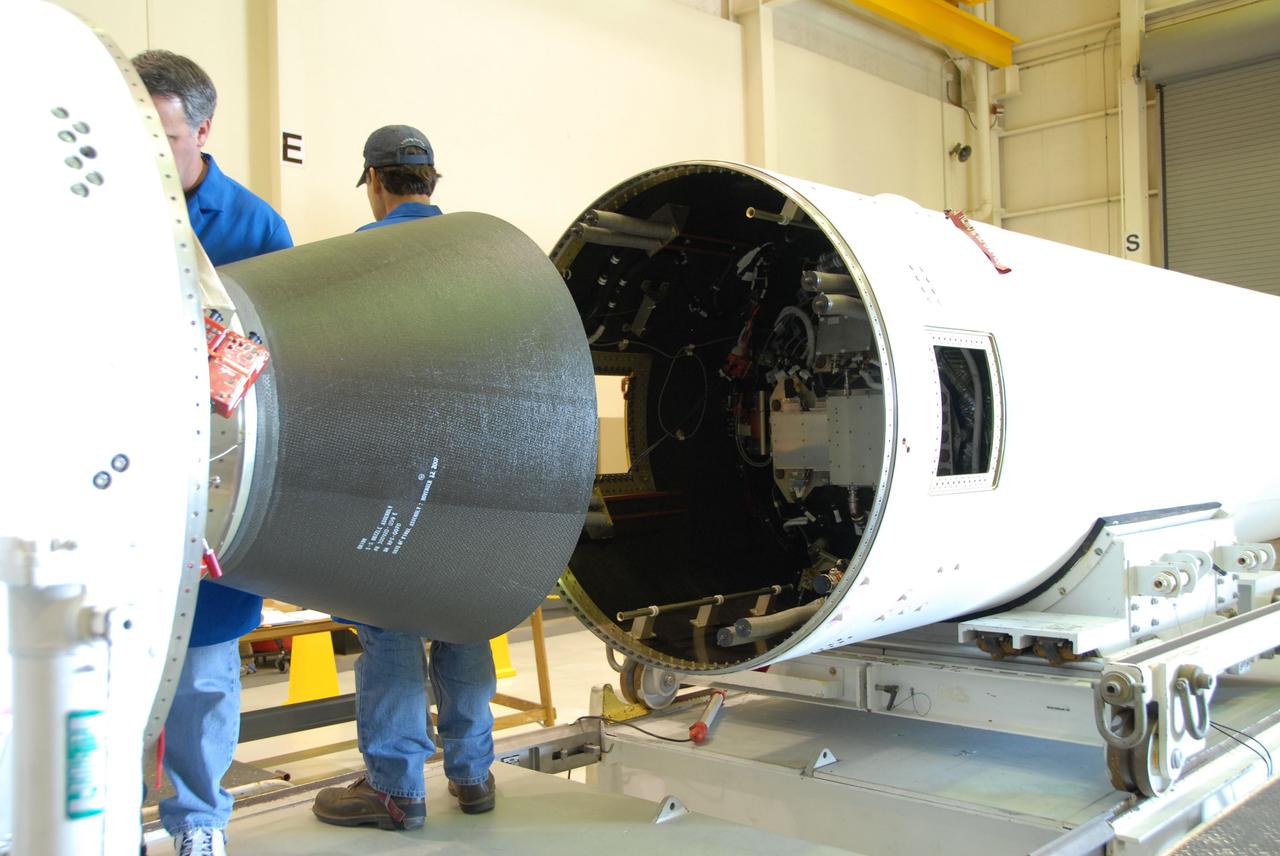 VANDENBERG AIR FORCE BASE, Calif. – At Vandenberg Air Force Base in California, work is under way to mate the first and second stages of the Taurus XL rocket in Orbital Sciences Corp.'s Building 1555.     The Orbital Sciences Taurus XL rocket, targeted to lift off Feb. 23, 2011, from Vandenberg's Space Launch Complex 576-E, will take NASA's Glory satellite into low Earth. Glory is scheduled to collect data on the properties of aerosols and black carbon. It also will help scientists understand how the sun's irradiance affects Earth's climate.  Photo credit: NASA/Chris Wiant, VAFB