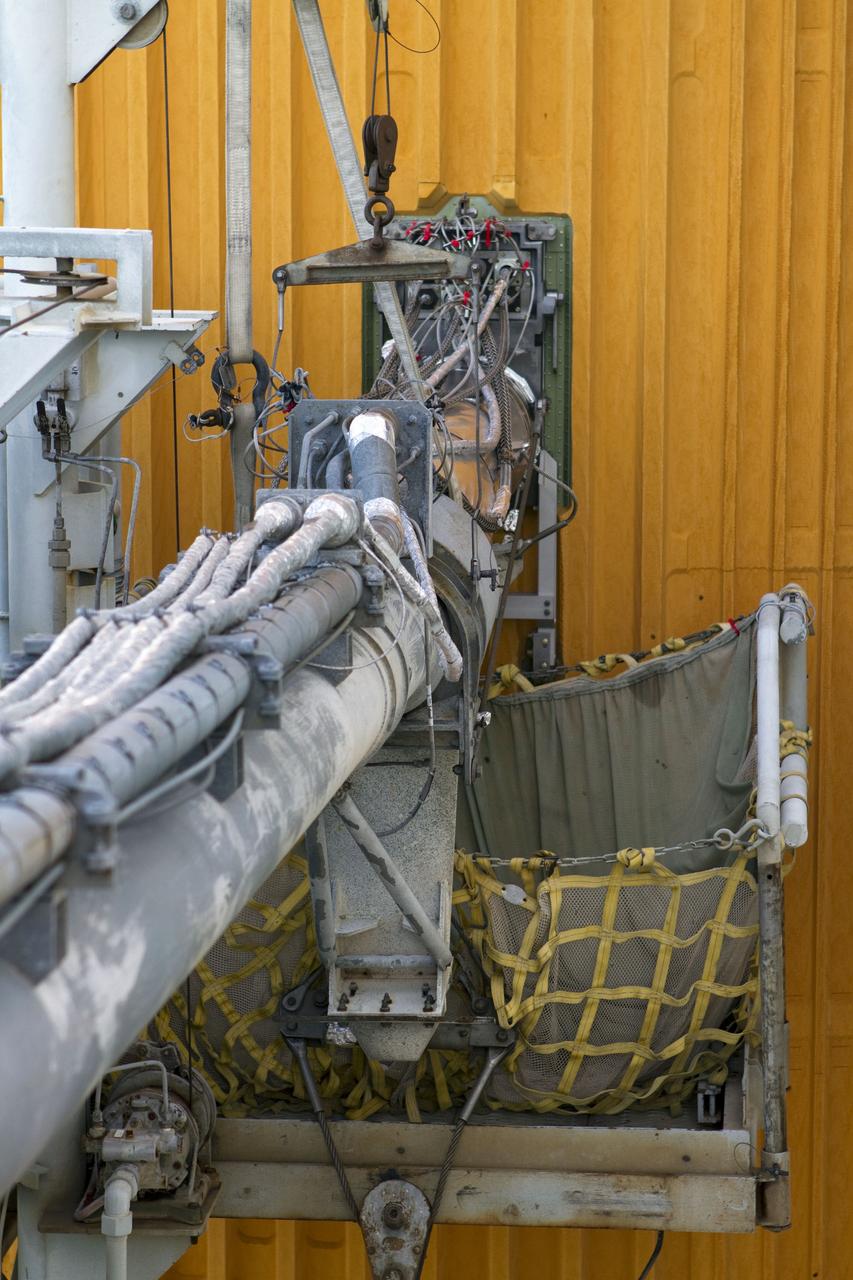 CAPE CANAVERAL, Fla. -- On Launch Pad 39A at NASA's Kennedy Space Center in Florida, the ground umbilical carrier plate (GUCP) of space shuttle Discovery's external fuel tank has been repaired. A hydrogen gas leak at that location during tanking for Discovery's STS-133 mission to the International Space Station caused the launch attempt to be scrubbed Nov. 5. The GUCP is the overboard vent to the pad and the flame stack where the excess hydrogen is burned off. Discovery's next launch attempt is no earlier than Dec. 17 at 8:51 p.m. EST. Until then, engineers will continue to analyze data from the GUCP and stringer crack repairs. For more information on STS-133, visit www.nasa.gov/mission_pages/shuttle/shuttlemissions/sts133/. Photo credit: NASA/Cory Huston
