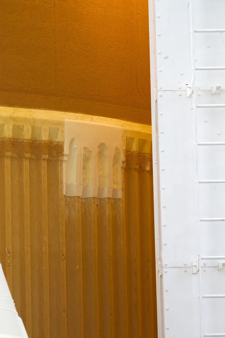 CAPE CANAVERAL, Fla. -- On Launch Pad 39A at NASA's Kennedy Space Center in Florida, the cracks on space shuttle Discovery's external fuel tank have been repaired. The foam cracked during initial loading operations for Discovery’s STS-133 mission to the International Space Station on Nov. 5. The cracks were on two of the 108 stringers, which are the composite aluminum ribs located vertically on the intertank area. Discovery's next launch attempt is no earlier than Dec. 17 at 8:51 p.m. EST. Until then, engineers will continue to analyze data from the GUCP and stringer crack repairs. For more information on STS-133, visit www.nasa.gov/mission_pages/shuttle/shuttlemissions/sts133/. Photo credit: NASA/Cory Huston