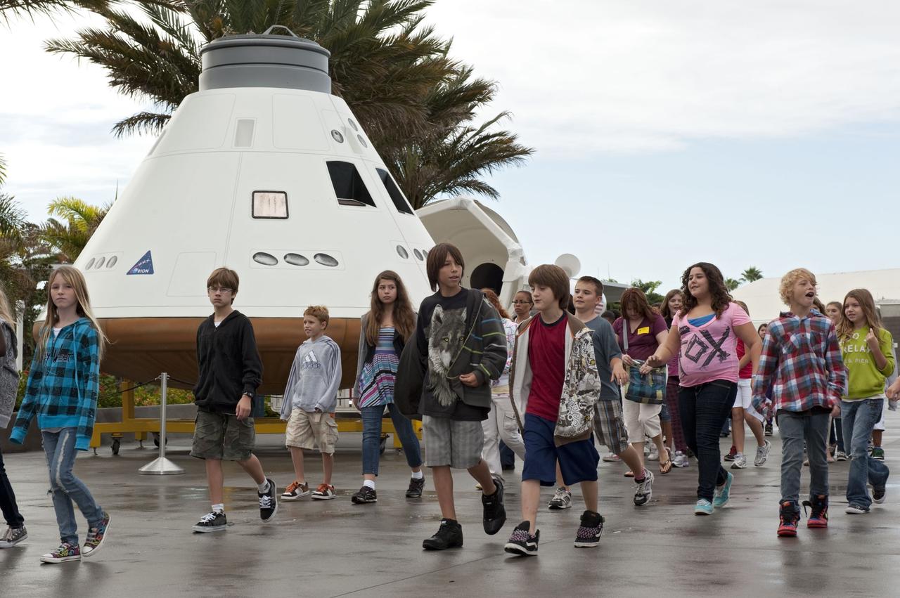 CAPE CANAVERAL, Fla. -- Brevard County sixth-graders participate in the eighth annual Space Week at the Kennedy Space Center Visitor Complex in Florida. Seen behind the students is a mock-up of NASA's Orion crew exploration vehicle, which was built by Guard-Lee Inc. of Apopka, Fla.    About 5,000 students will participate throughout the 11-day event, which contains fun space exploration activities designed to emphasize the importance of science, technology, engineering and math (STEM). Space Week is sponsored by NASA Education, Brevard Public Schools, Delaware North Companies Parks and Resorts, and the Florida Chapter of the National Space Club. Photo Credit: NASA/Kim Shiflett