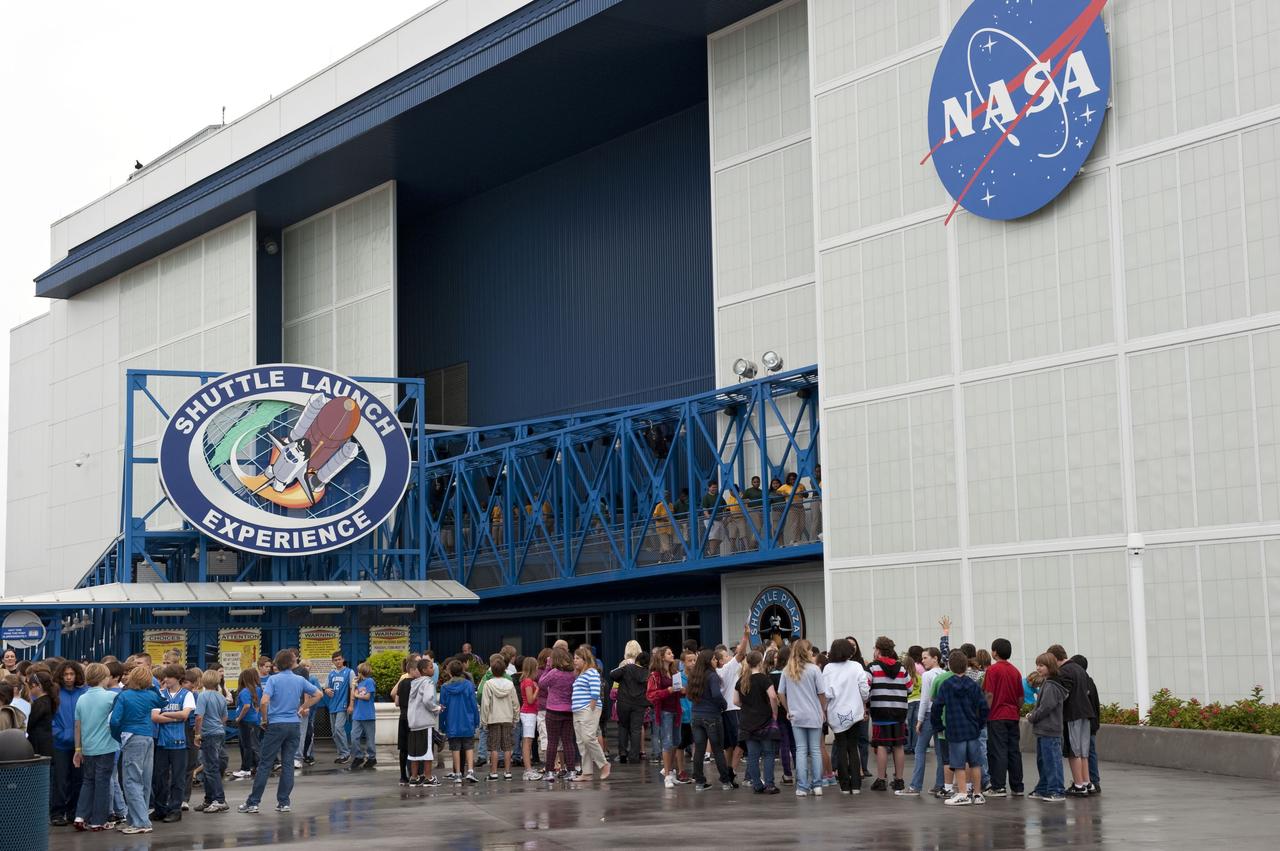 CAPE CANAVERAL, Fla. -- Brevard County sixth-graders participate in the eighth annual Space Week at the Kennedy Space Center Visitor Complex in Florida. Here, the students wait to take a ride on the Shuttle Launch Experience, which mimics the sights, sounds and sensations of a real space shuttle launch.          About 5,000 students will participate throughout the 11-day event, which contains fun space exploration activities designed to emphasize the importance of science, technology, engineering and math (STEM). Space Week is sponsored by NASA Education, Brevard Public Schools, Delaware North Companies Parks and Resorts, and the Florida Chapter of the National Space Club. Photo Credit: NASA/Kim Shiflett