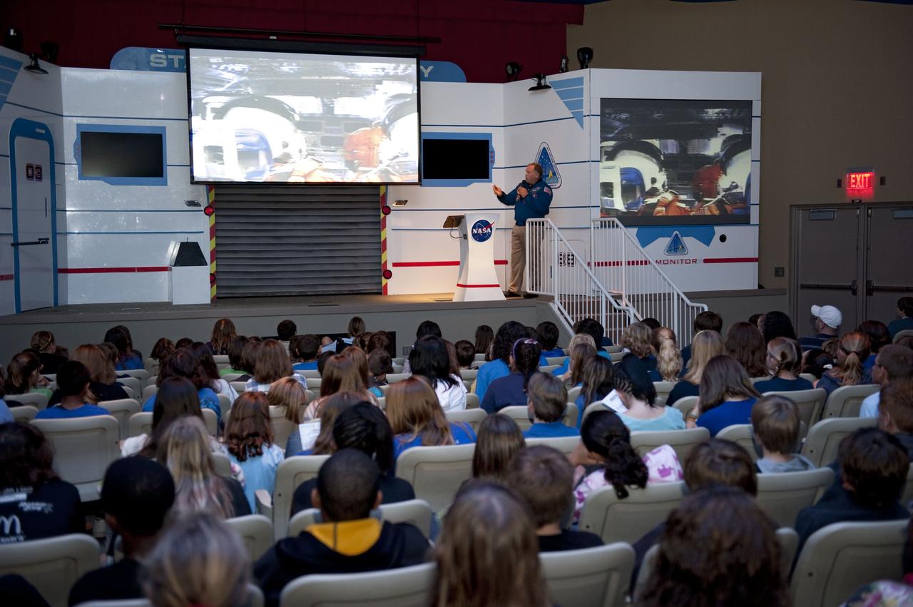 CAPE CANAVERAL, Fla. -- Brevard County sixth-graders participate in the eighth annual Space Week at the Kennedy Space Center Visitor Complex in Florida. Here, the students learn about launching to Earth's orbit from former NASA astronaut Mark Lee, a veteran of four space shuttle missions.         About 5,000 students will participate throughout the 11-day event, which contains fun space exploration activities designed to emphasize the importance of science, technology, engineering and math (STEM). Space Week is sponsored by NASA Education, Brevard Public Schools, Delaware North Companies Parks and Resorts, and the Florida Chapter of the National Space Club. Photo Credit: NASA/Kim Shiflett