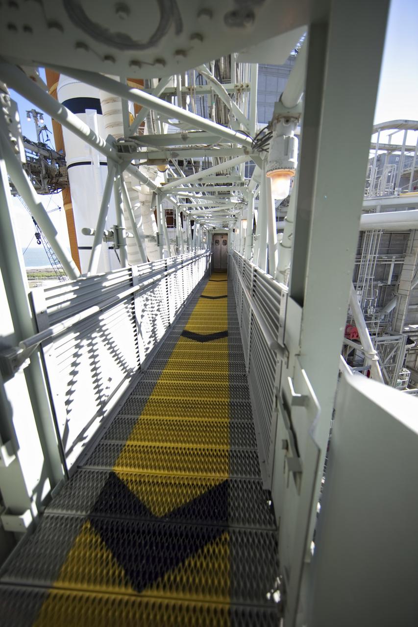 CAPE CANAVERAL, Fla. -- The orbiter access arm extends toward the White Room on Launch Pad 39A at NASA's Kennedy Space Center in Florida. From the White Room, the STS-133 crew members will board space shuttle Discovery for their launch to the International Space Station. Launch is no earlier than Dec. 17 at 8:51 p.m. EST.      For more information on STS-133, visit www.nasa.gov/mission_pages/shuttle/shuttlemissions/sts133/. Photo credit: NASA/Frank Michaux