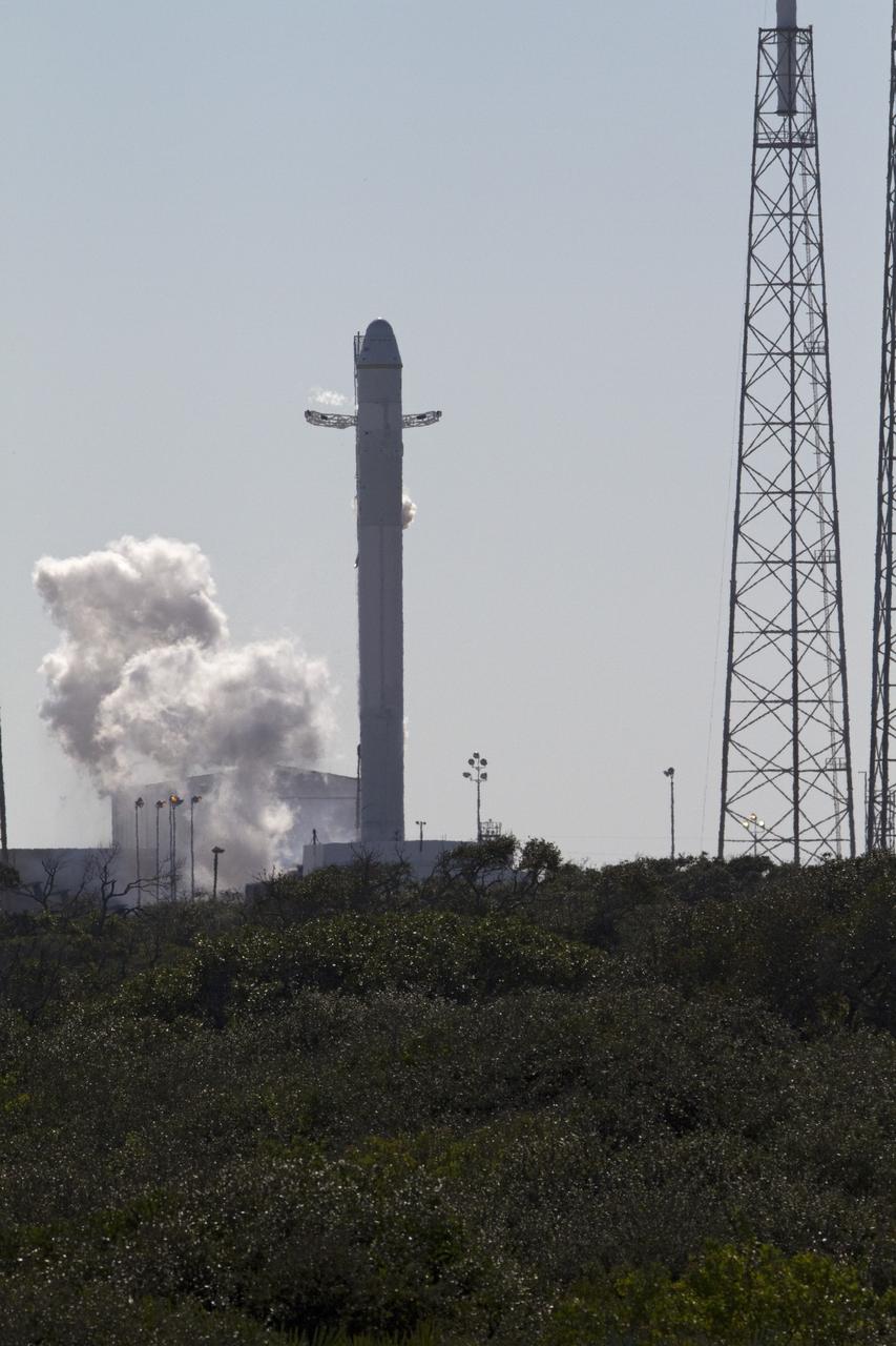 CAPE CANAVERAL, Fla. -- The SpaceX Falcon 9 rocket static fire test on Space Launch Complex-40 at Cape Canaveral Air Force Station was aborted at T minus 1.1 seconds due to high engine chamber pressure.   During the test, all nine Merlin engines, which use rocket-grade kerosene and liquid oxygen to produce 1 million pounds of thrust, are expected to fire at once. After the test, SpaceX will conduct a thorough review of all data as engineers make final preparations for the first launch of the Commercial Orbital Transportation Services (COTS) Dragon spacecraft to low Earth orbit atop the Falcon 9.        This first stage firing is part of a full launch dress rehearsal, which will end after the engines fire at full power for two seconds, with only the hold-down system restraining the rocket from flight.  Photo credit: NASA/Rusty Backer