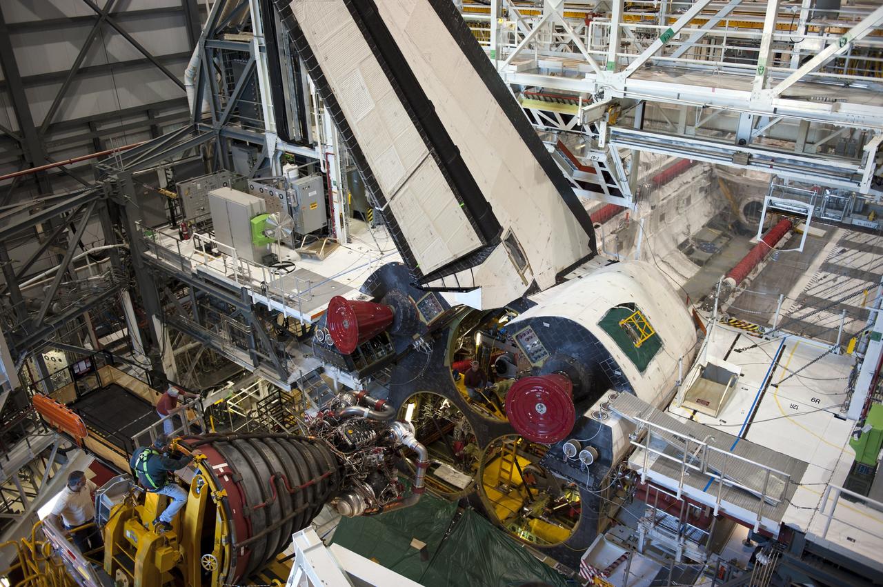 CAPE CANAVERAL, Fla. -- In Orbiter Processing Facility-1 at NASA's Kennedy Space Center in Florida, a Hyster forklift moves the first of three space shuttle main engines closer to space shuttle Atlantis for installation. Each engine is 14 feet long, weighs about 6,700 pounds, and is 7.5 feet in diameter at the end of the nozzle. This is the final planned engine installation for the Space Shuttle Program.            Atlantis is being prepared for the "launch on need," or potential rescue mission, for the final planned shuttle flight, Endeavour's STS-134 mission. For more information, visit www.nasa.gov/shuttle. Photo credit: NASA/Kim Shiflett