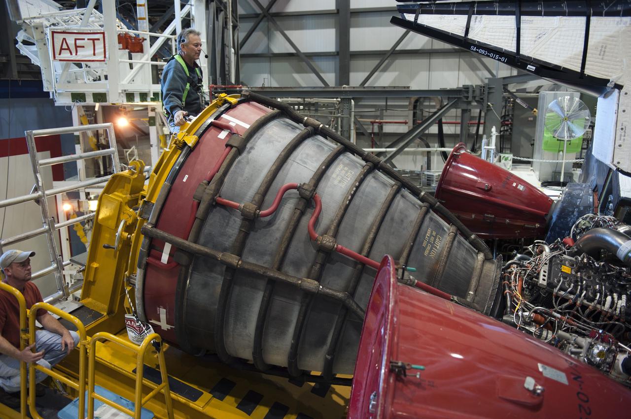 CAPE CANAVERAL, Fla. -- In Orbiter Processing Facility-1 at NASA's Kennedy Space Center in Florida, a Hyster forklift moves the first of three space shuttle main engines closer to space shuttle Atlantis for installation. Each engine is 14 feet long, weighs about 6,700 pounds, and is 7.5 feet in diameter at the end of the nozzle. This is the final planned engine installation for the Space Shuttle Program.            Atlantis is being prepared for the "launch on need," or potential rescue mission, for the final planned shuttle flight, Endeavour's STS-134 mission. For more information, visit www.nasa.gov/shuttle. Photo credit: NASA/Kim Shiflett