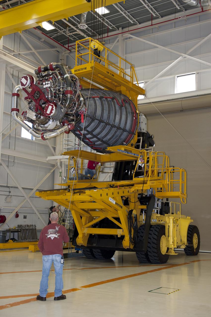 CAPE CANAVERAL, Fla. -- Workers in the Space Shuttle Main Engine (SSME) Shop at NASA's Kennedy Space Center in Florida attached the second of shuttle Atlantis' three main engines to a Hyster forklift. Next, the engine will be transported to Orbiter Processing Facility-1 where it will be installed in the shuttle. Each engine is 14 feet long, weighs about 6,700 pounds, and is 7.5 feet in diameter at the end of the nozzle. This is the final planned engine installation for the Space Shuttle Program.      Atlantis is being prepared for the "launch on need," or potential rescue mission, for the final planned shuttle flight, Endeavour's STS-134 mission. For more information, visit www.nasa.gov/shuttle. Photo credit: NASA/Kim Shiflett