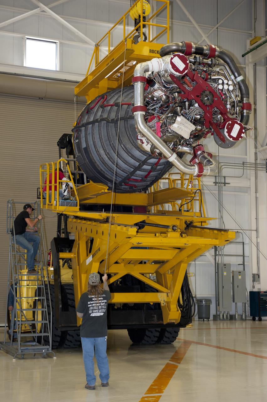 CAPE CANAVERAL, Fla. -- Workers in the Space Shuttle Main Engine (SSME) Shop at NASA's Kennedy Space Center in Florida attached the second of shuttle Atlantis' three main engines to a Hyster forklift. Next, the engine will be transported to Orbiter Processing Facility-1 where it will be installed in the shuttle. Each engine is 14 feet long, weighs about 6,700 pounds, and is 7.5 feet in diameter at the end of the nozzle. This is the final planned engine installation for the Space Shuttle Program.    Atlantis is being prepared for the "launch on need," or potential rescue mission, for the final planned shuttle flight, Endeavour's STS-134 mission. For more information, visit www.nasa.gov/shuttle. Photo credit: NASA/Kim Shiflett